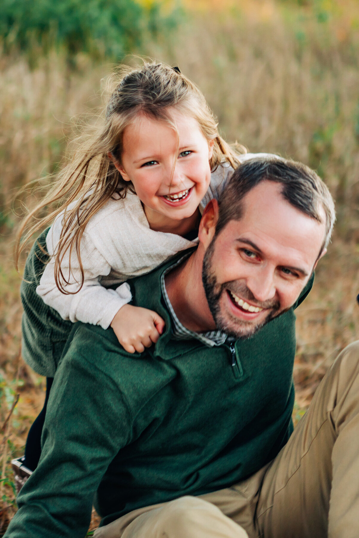 girl-climbing-dads-back