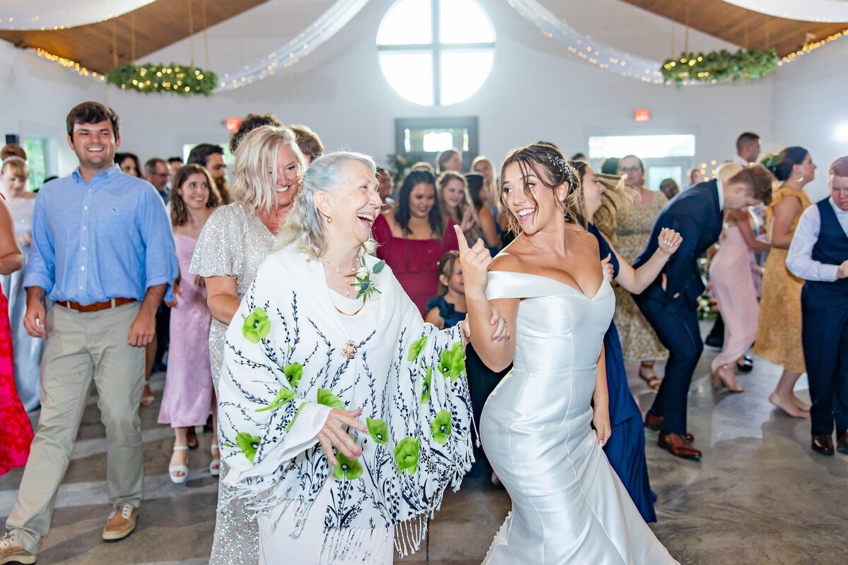 Bride dancing with her grandma during wedding reception