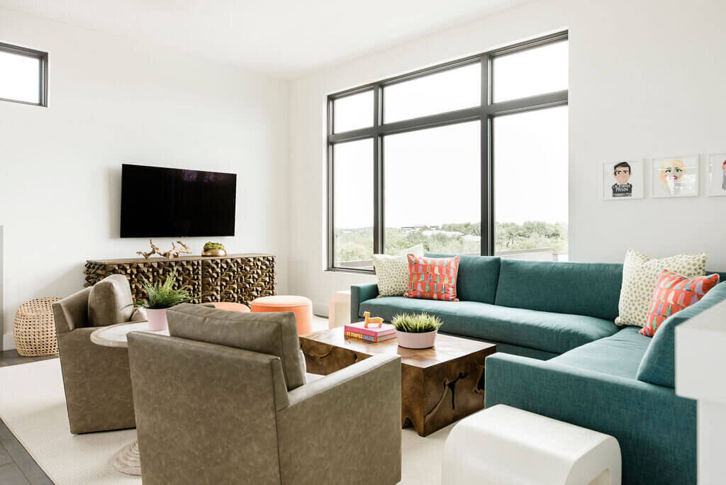oyster creek studios austin barton creek turquoise corner sofa with light brown leather chairs in living room