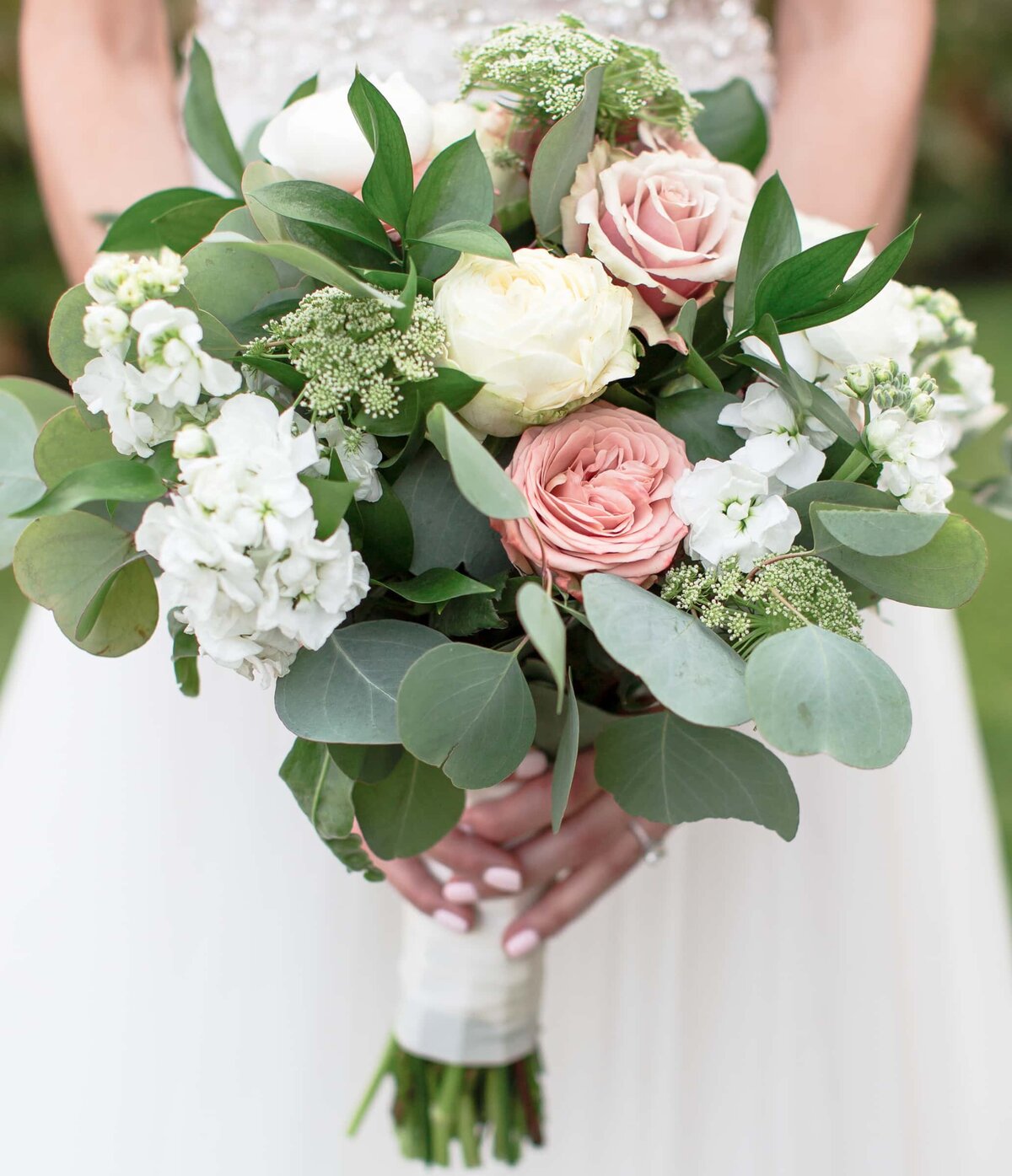 lush bridal bouquet with pink and white flowers and greenery