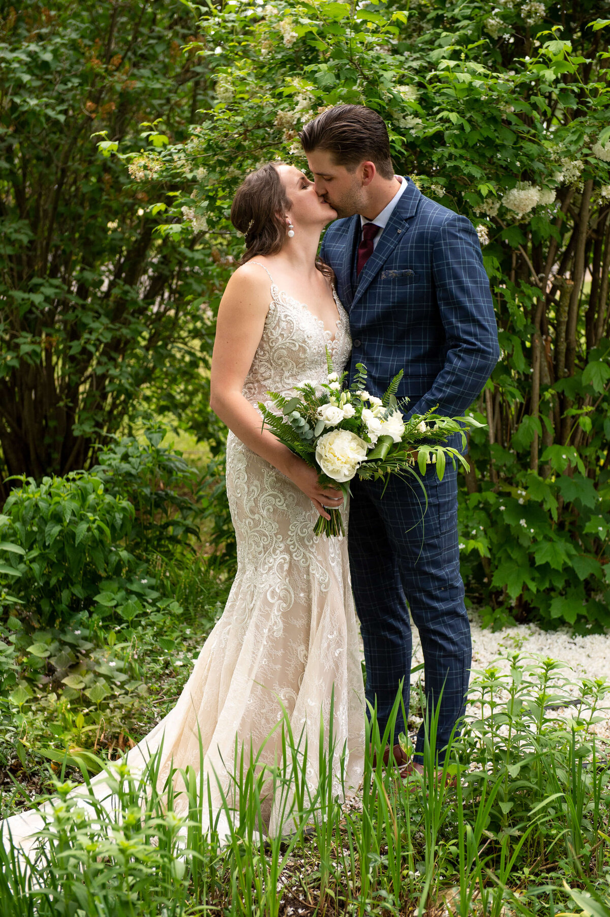 full length photo of an Ottawa bride and groom kissing during their micro wedding