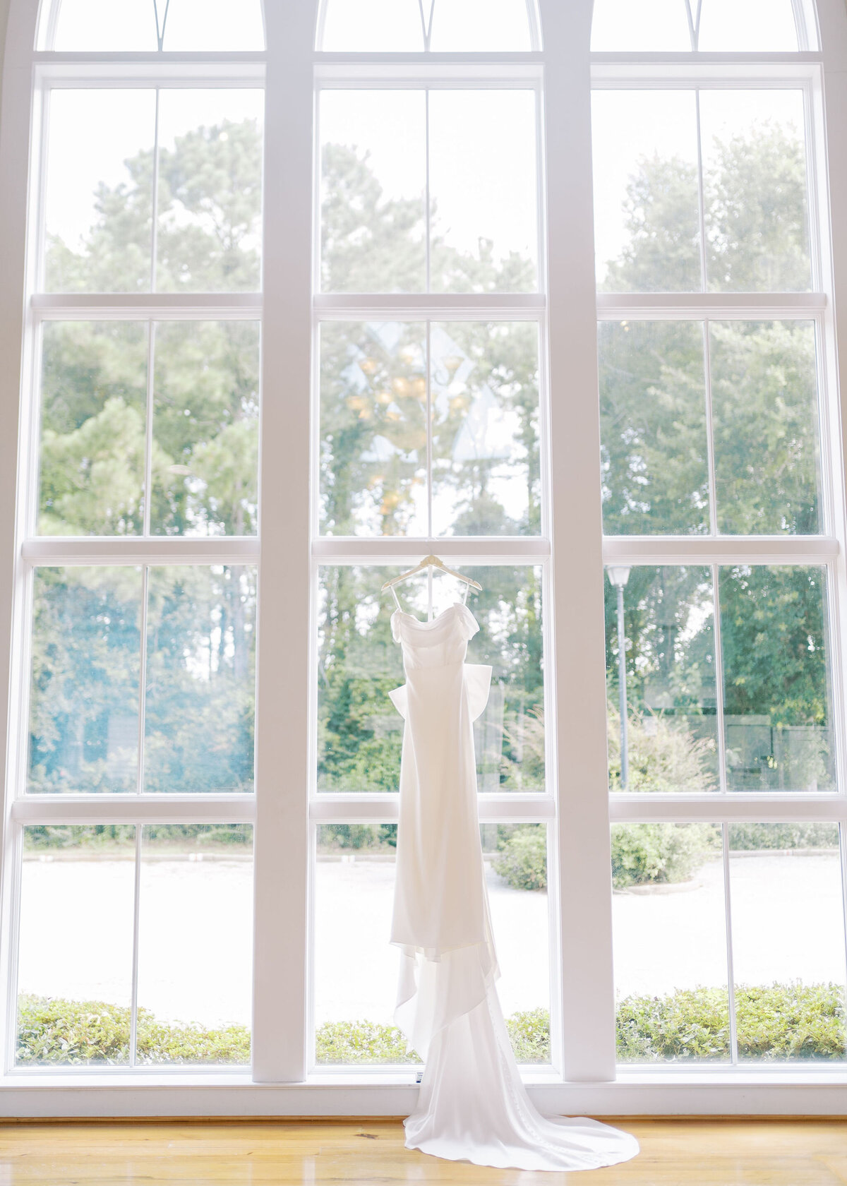 a wedding dress hanging up