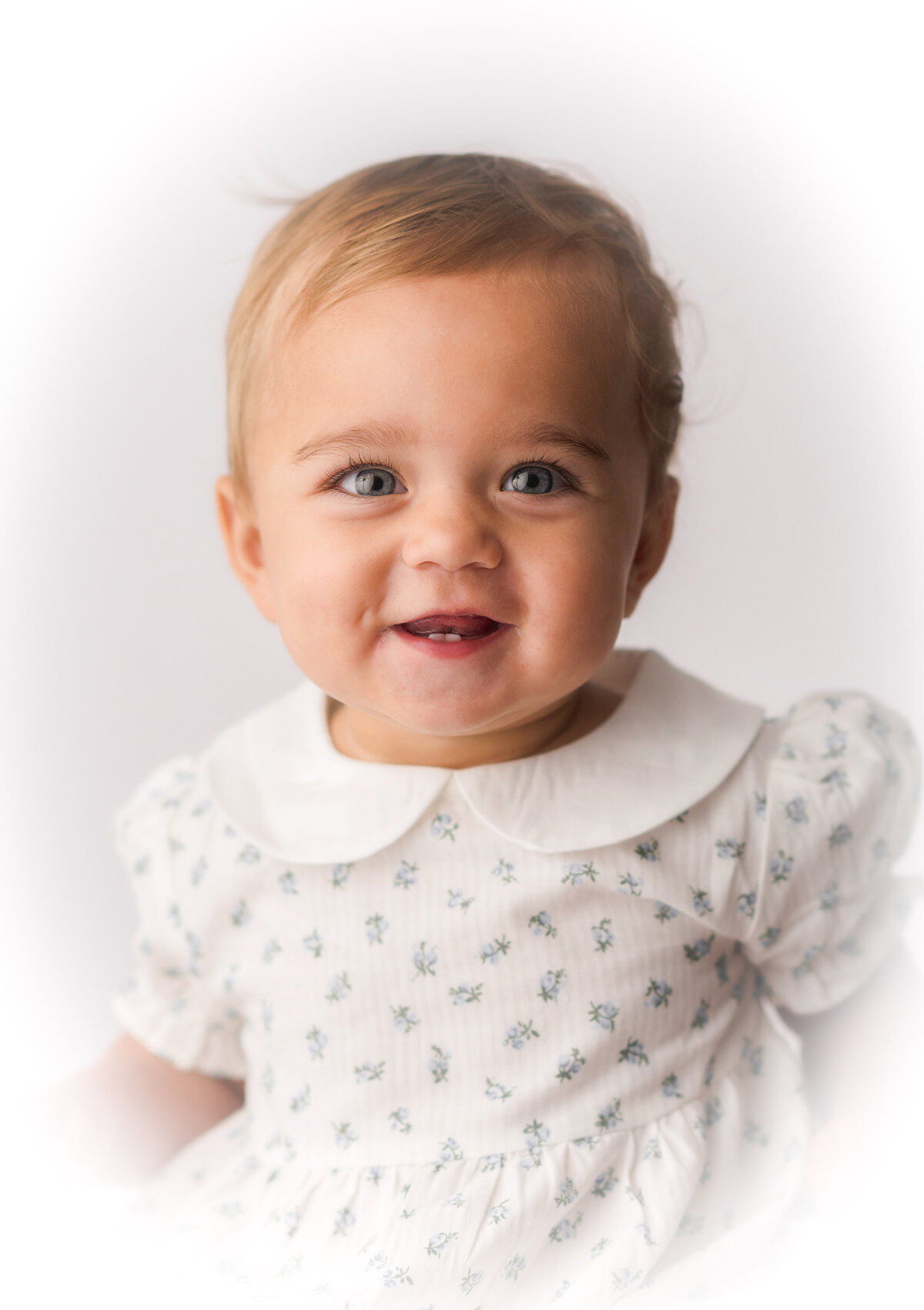 Baby smiles at the camera during Heirloom Portrait Photoshoot in Charleston, SC.