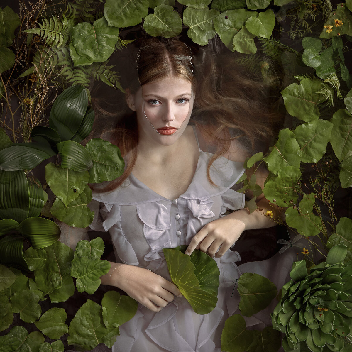 Children’s portrait of Ava, a finalist in the top 32 at the prestigious International Print Competition, awarded a Bronze Medal at Imaging USA. Captured by Chasity Rozell Photography, this stunning image of Ava floating in water surrounded by lilies showcases expert portrait photography in Edmond, Oklahoma. Specializing in children’s portraits, Chasity Rozell brings over 20 years of experience in creating award-winning, artistic photography.