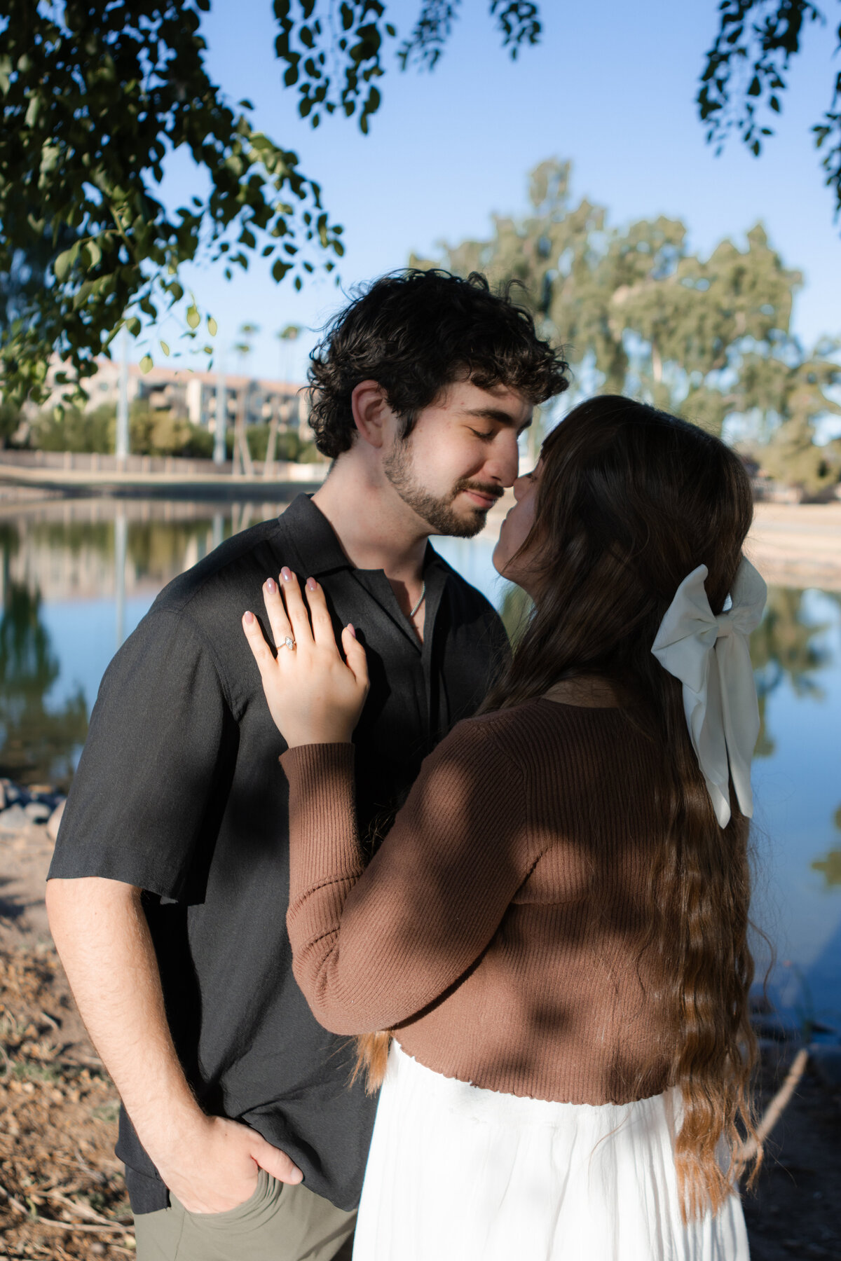 Jovanna G Photography. Classic, sophisticated Wedding Photos. Soft romantic engagement photos. Soft romantic WeddingPhotos. Sophisticated Wedding Photographer. Professional Wedding Photographer. Destination Wedding Photographer. Luxury Wedding photographer. Traveling Wedding Photographer. AZ Wedding Photographer. Gilbert AZ Wedding Photographer. Queen Creek Wedding Photographer. Phoenix Wedding Photographer. Scottsdale Wedding Photographer. Flagstaff Wedding Photographer. SoCal Wedding Photographer. California Wedding Photographer. Northern California Wedding Photographer. Southern California Wedding Photographer. San Francisco Wedding Photographer. Bay Area Wedding Photographer. San Jose Wedding Photographer. Golden Gate Bridge Wedding Photographer. Beach Lover Wedding Photographer. Palace of the Fine Arts Wedding Photographer. Ocean Lover. I love California. Orange County Wedding Photographer. Newport Beach Couples Photographer. Newport Beach Wedding Photographer. Laguna Beach Couples Beach Engagement Photographer. Laguna Beach wedding beach photographer. Los Angeles Wedding Photographer. Young and in love engaged couples who live in southern California. Christian Young Couple. Young Engaged Couple. Engaged High School Christian Couple. Christian Values. Young conservative Christian women. Young Conservative Christian men. Young Conservative Christian Couple. Young Christian Couple Engaged in High School. Young Christian College Couple. Lakeside Lovers in the Autumn Sun. David & Grace - engagement photos. Jovanna G Photographer Engagement Photos. Arizona sun shining through autumn trees- engagement. Chandler, AZ Engagement Photos. Chandler, AZ 2026 bride. Chandler, AZ Wedding Photographer. Chandler, AZ Young Engaged Couple. Girl in her 20s. Engaged Arizona Girl in her 20s. Lakeside Engagement photos. AZ Lakeside Engagement Photos. AZ Weeping Willow Lakeside Proposal. Arizona Lakeside Proposal with weeping willow tree. Detail shot of engagement ring on Arizona Lakeside estate. Chandler, AZ Lakeside Estate Proposal Outfit Inspiration.