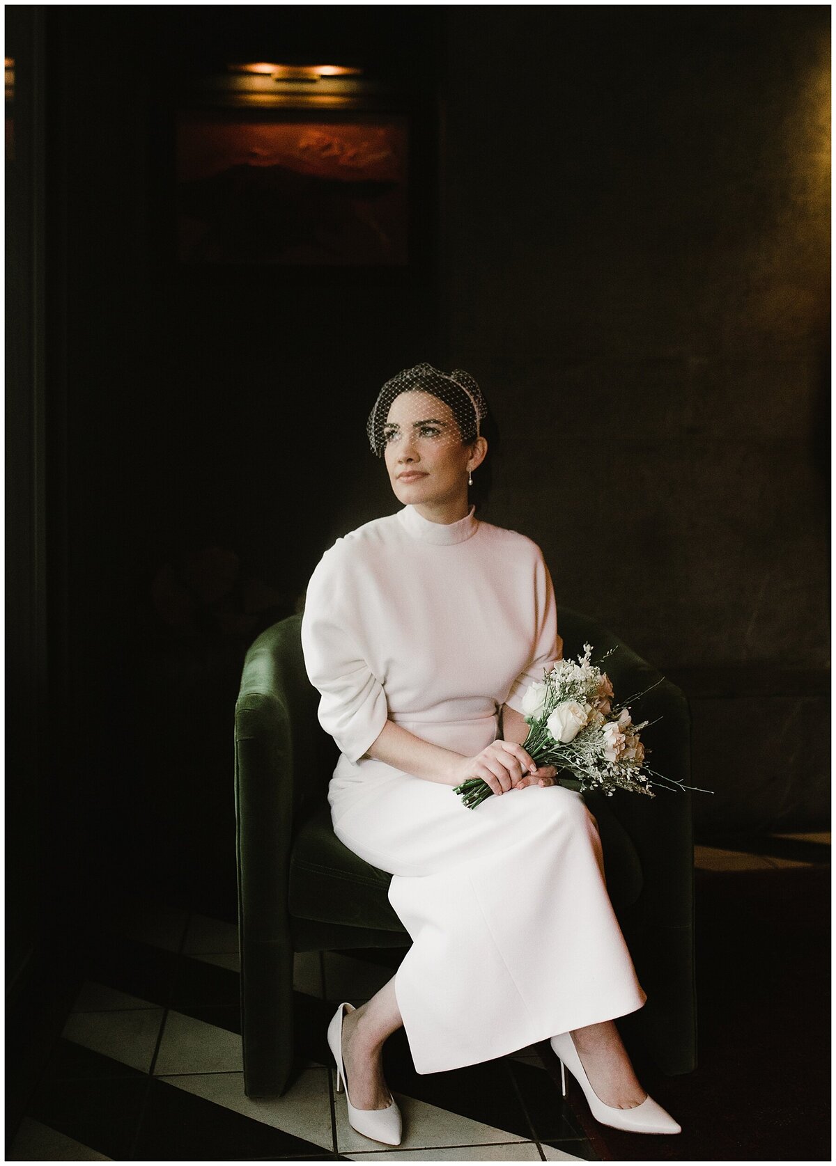 Bride sitting down looking afar at Hotel Saint Cecilia Wedding