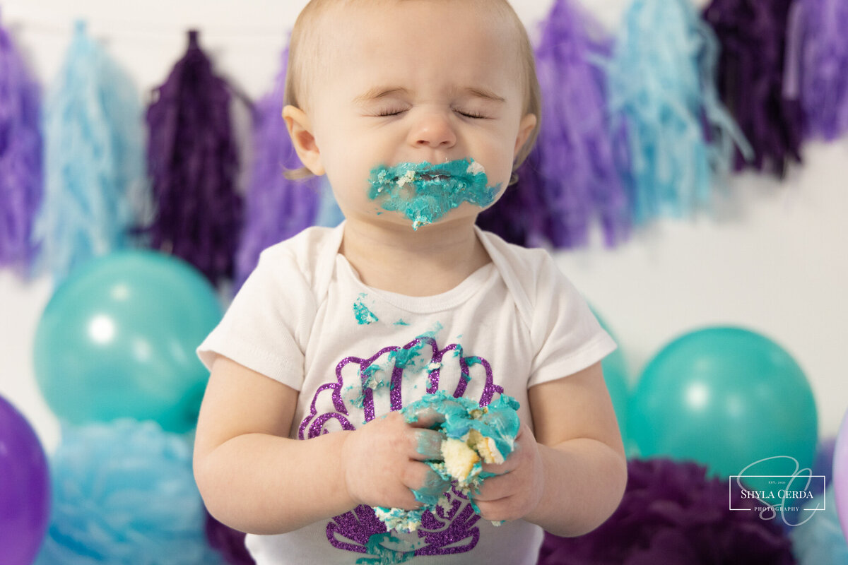 Baby tasting cake for the first time