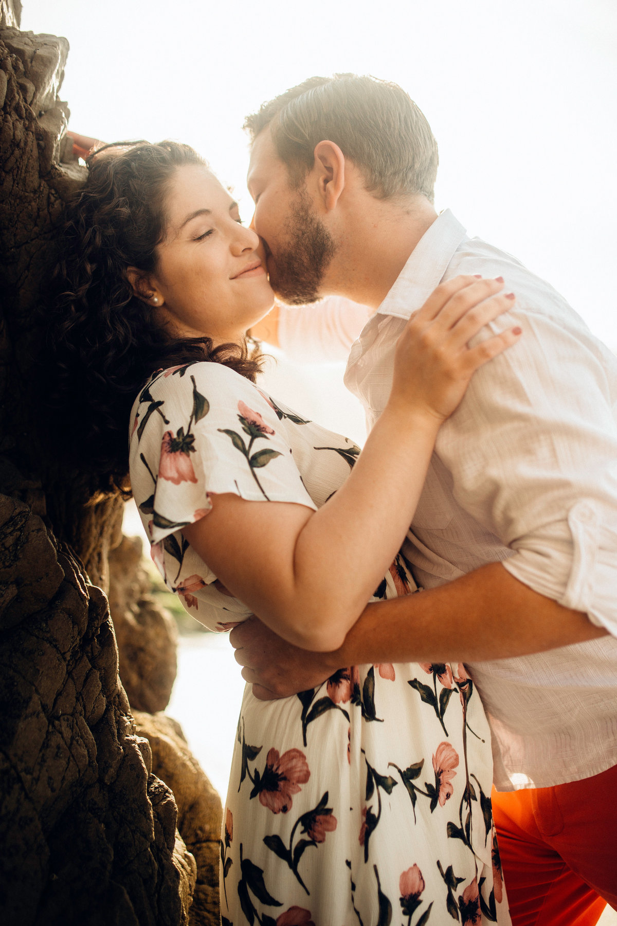Engagement Photograph Of  Man Kissing a Woman On The Cheeks Los Angeles