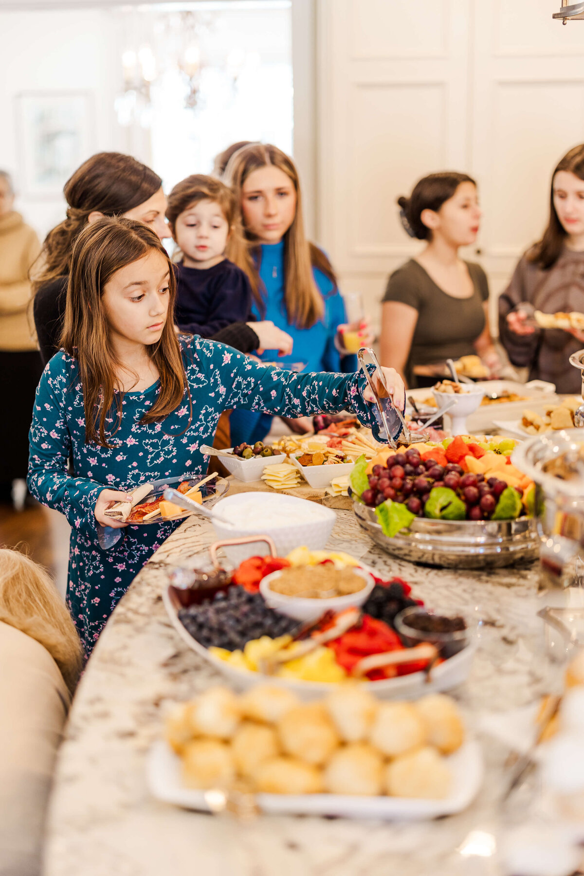 Children lined up for a buffet at a community event party in fayetteville nc