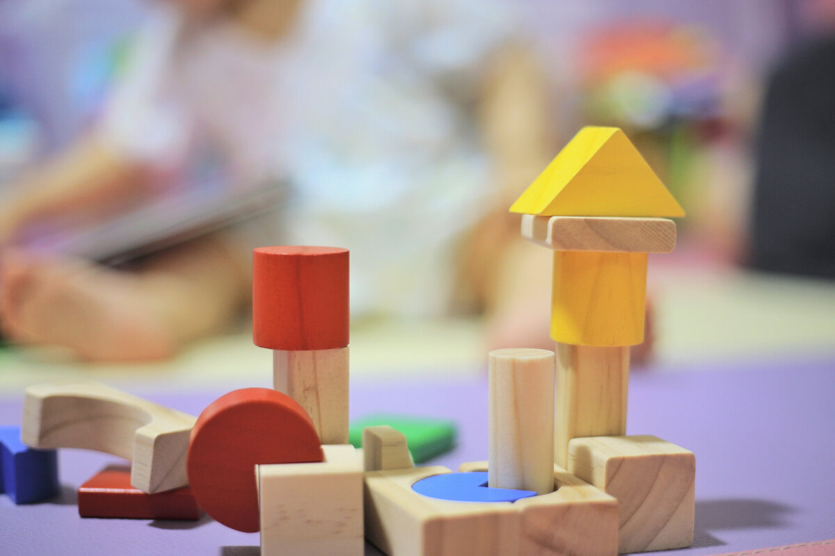 Wooden blocks stacked in a children's play area