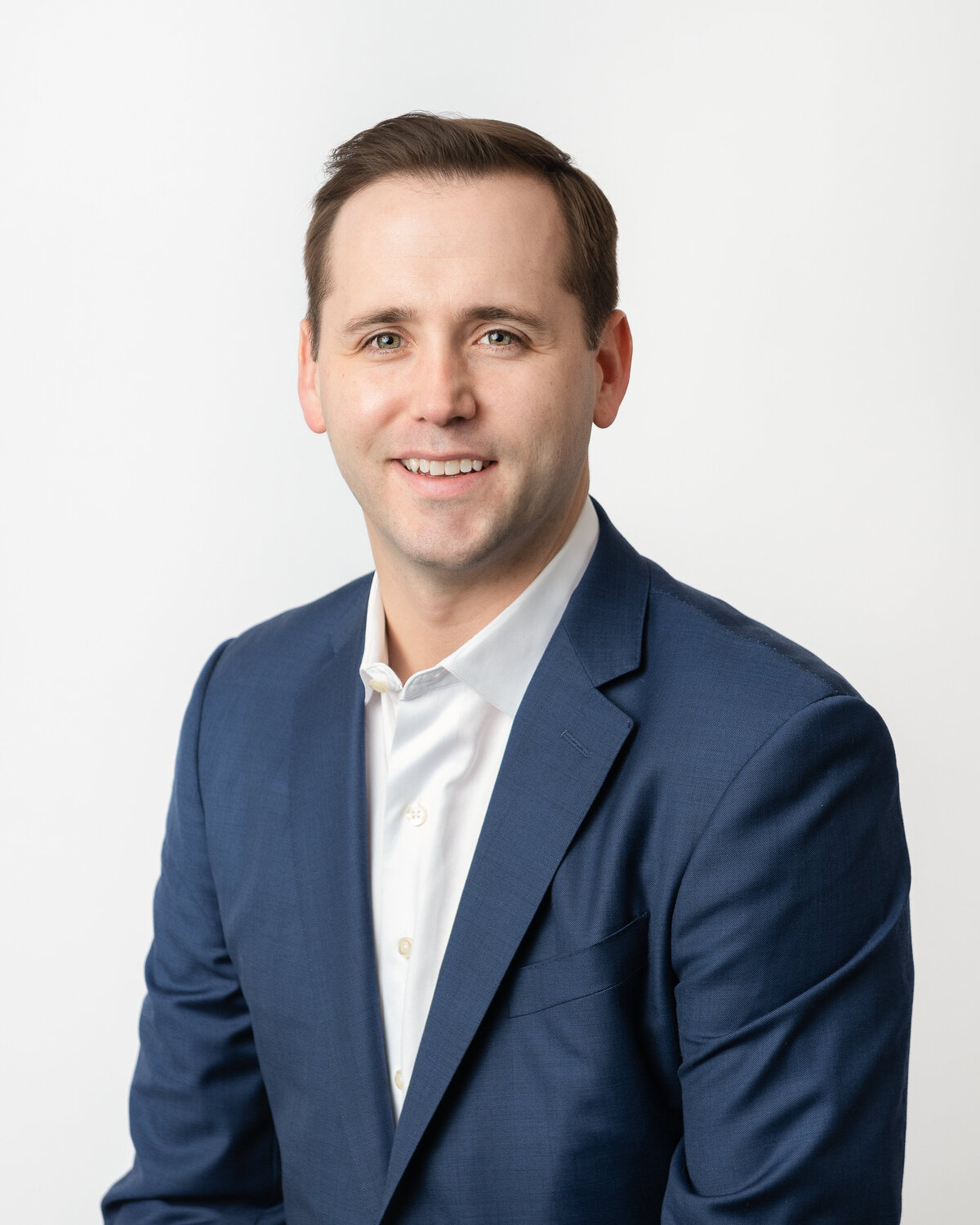 Headshot-of-man-wearing-blue-suit