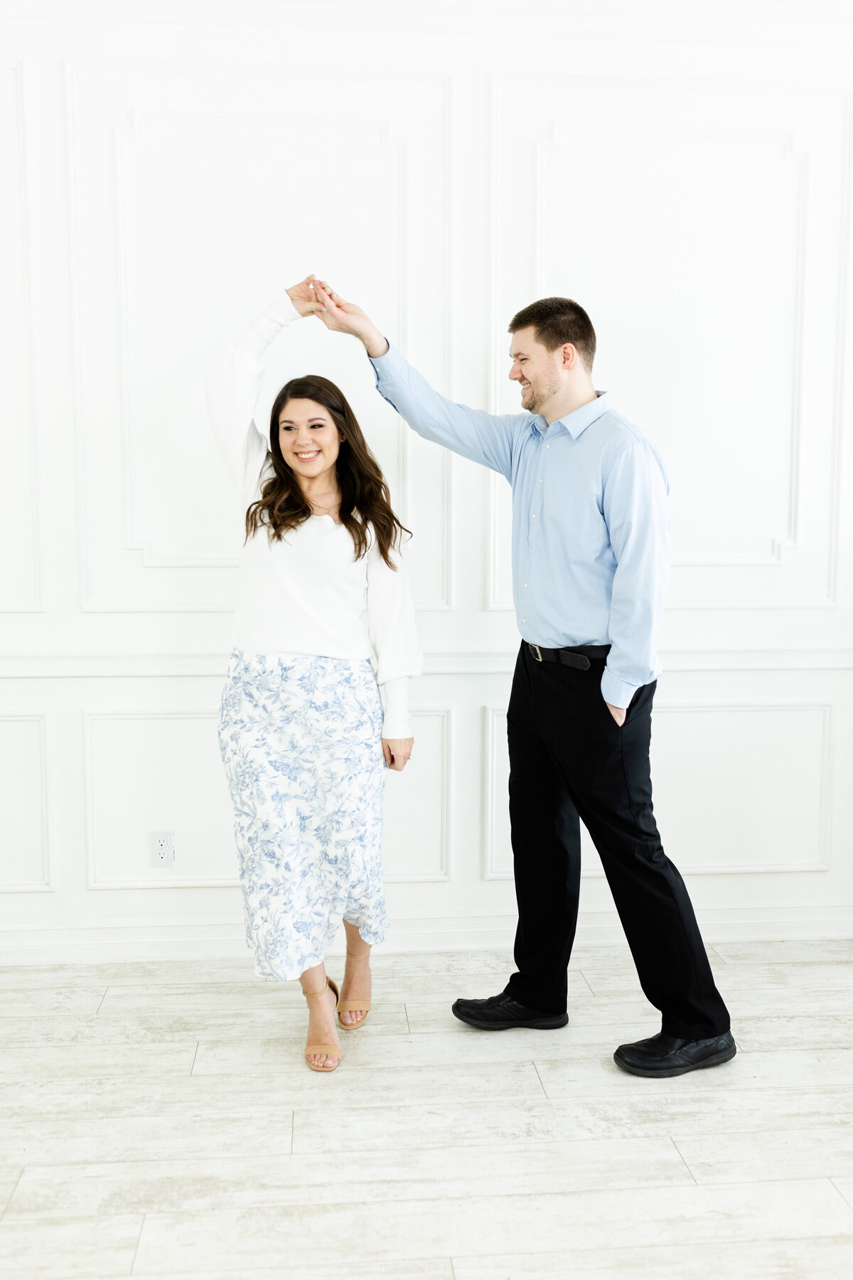 husband and wife wedding photographers posing for brand photos