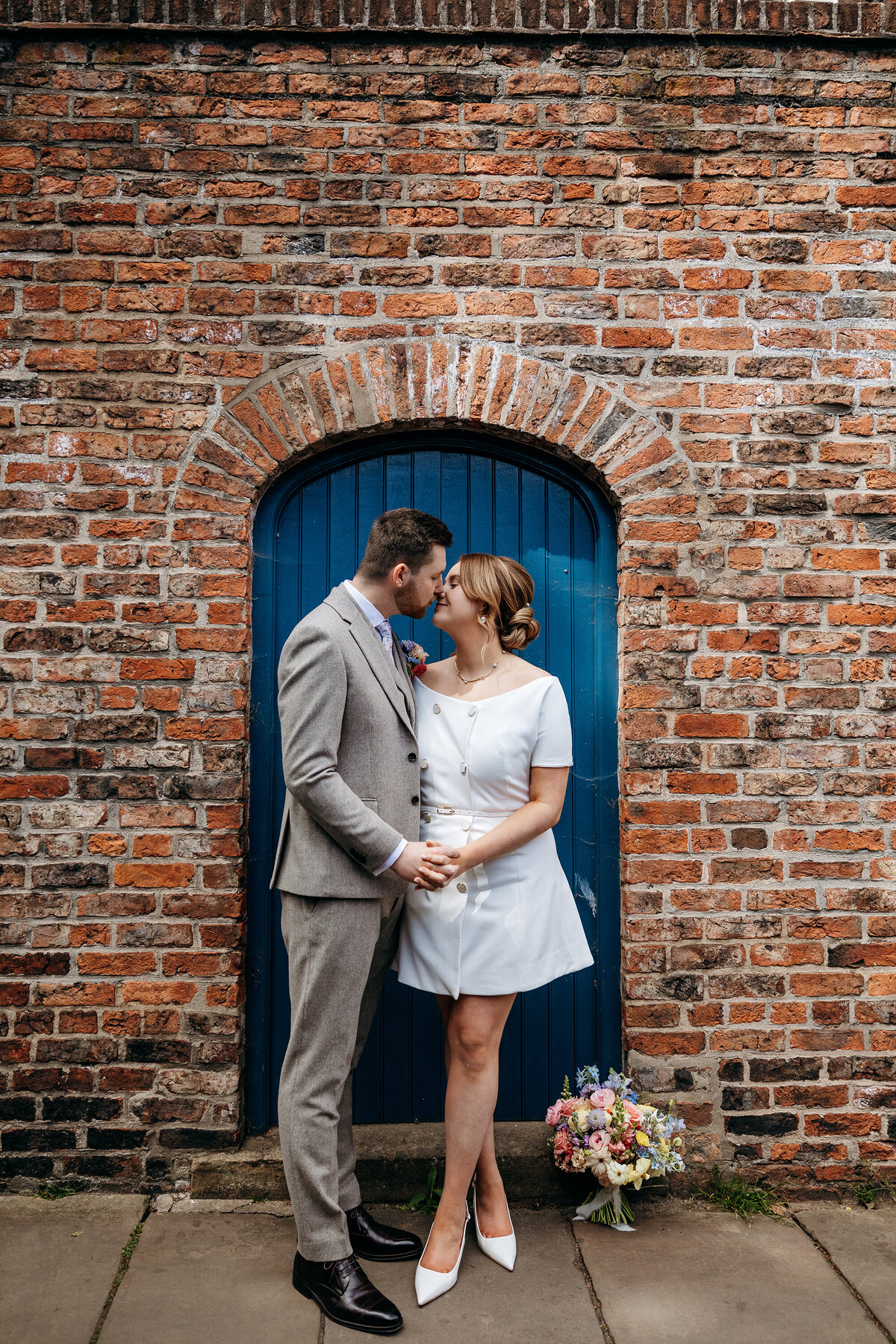 Bride and groom city wedding in York, bride in short wedding dress