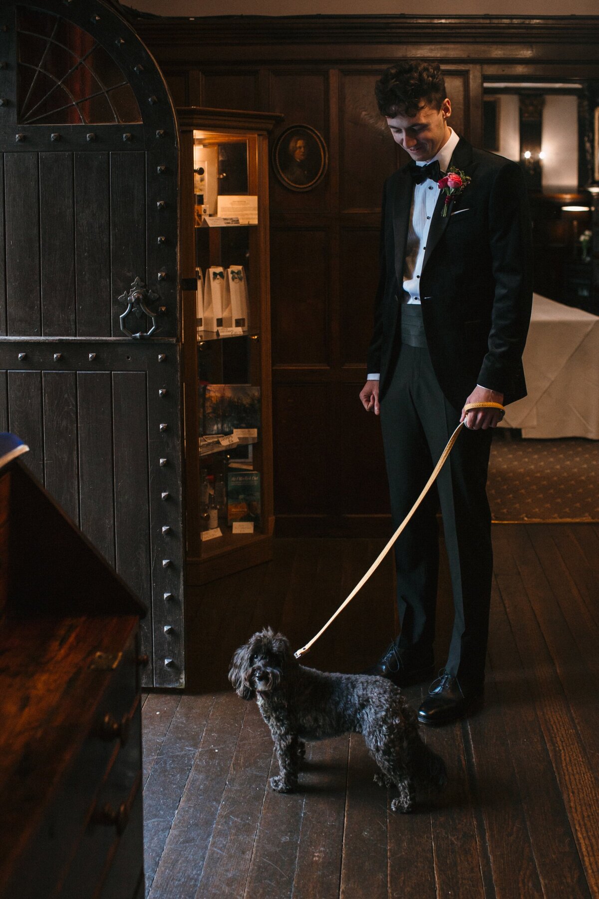 grey bridesdog and groomsmen about to make an entrance at the wedding