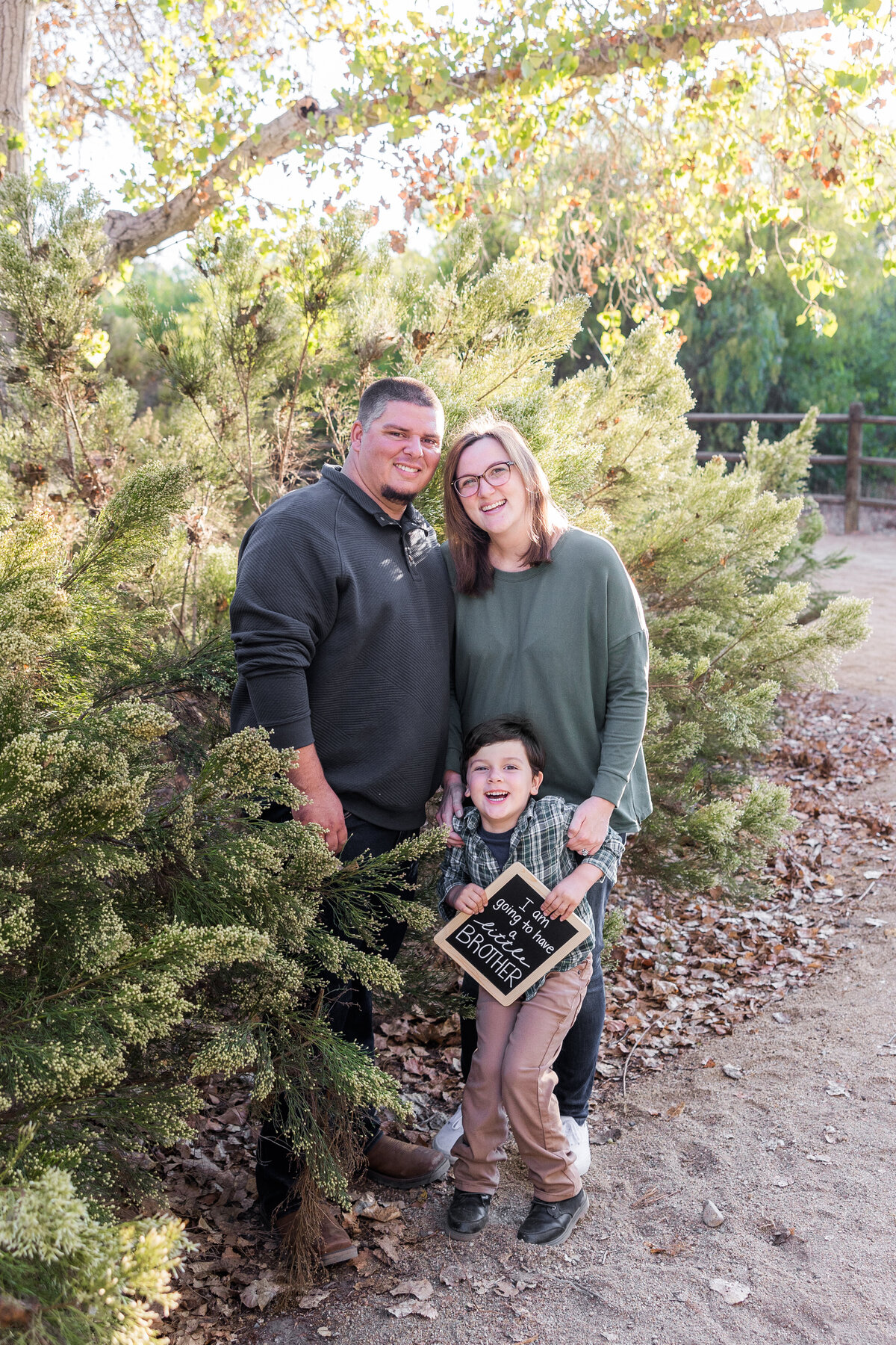 parents standing in bushes in Bonita San Diego
