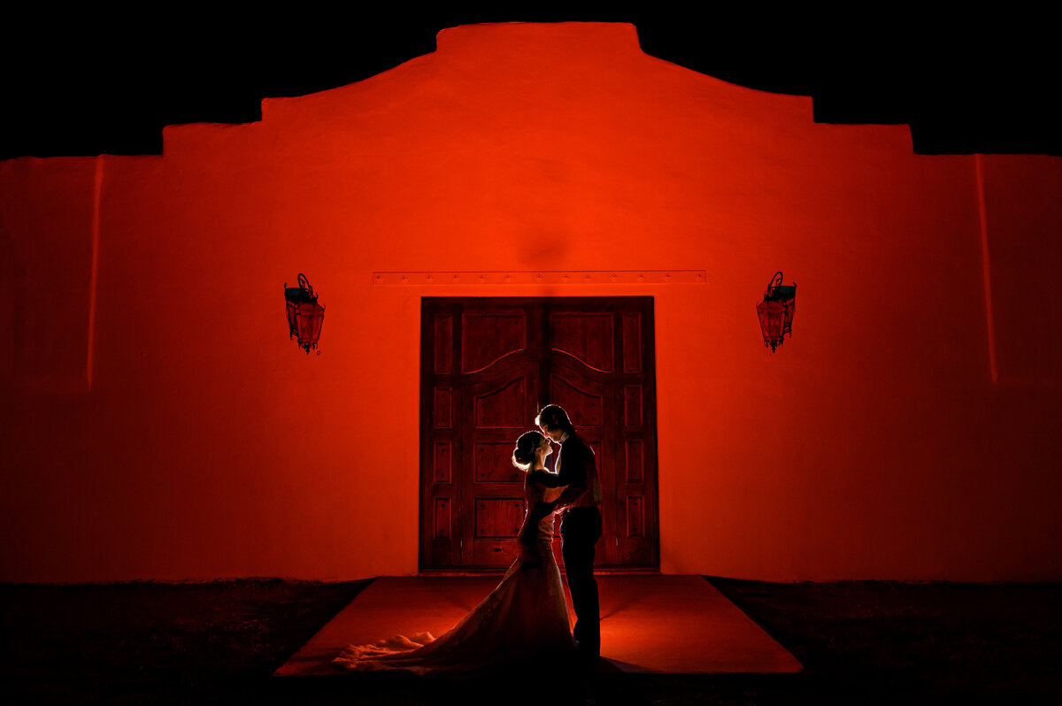 a bride and groom embrace after their wedding at Los Portales in El Paso Texas