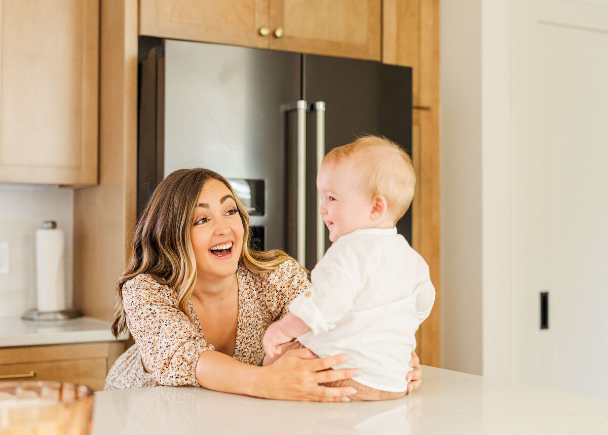 mom-and-baby-in-kitchen-smiling-lifestyle-in-home-ann-arbor-28