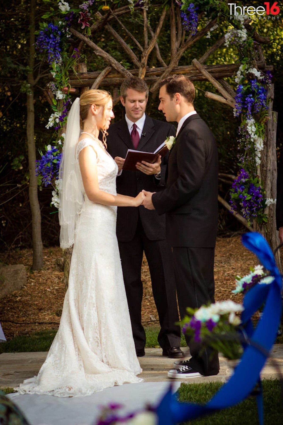Saying their vows at a Temecula Creek Inn Wedding