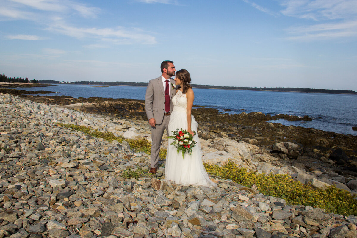 Bride and Groom standing on rocky beach together | Bar Harbor, Maine Wedding
