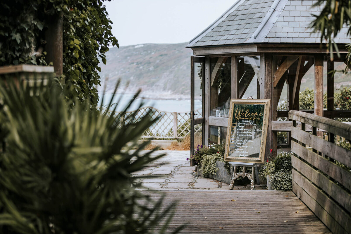 A gazebo sitting on top of a wooden walkway