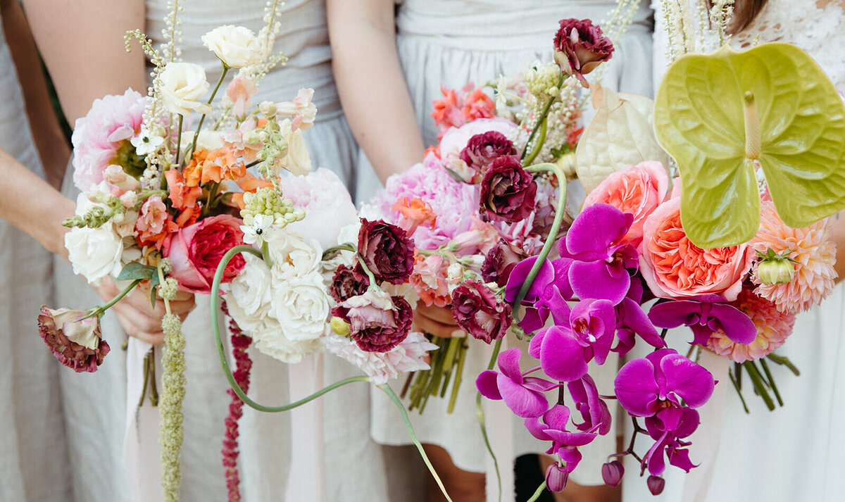 Colourful pink and magenta tropical wedding bouquets