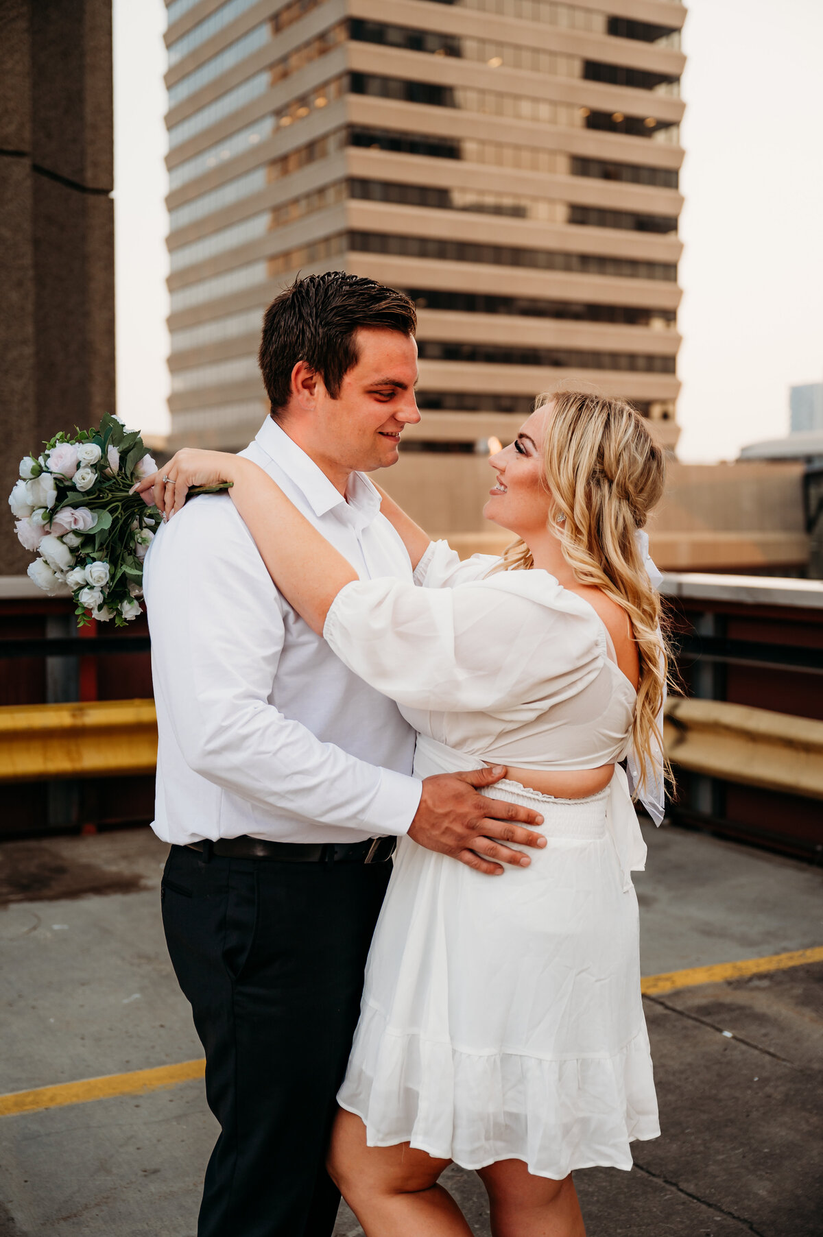 Engaged couple looks into each others eyes