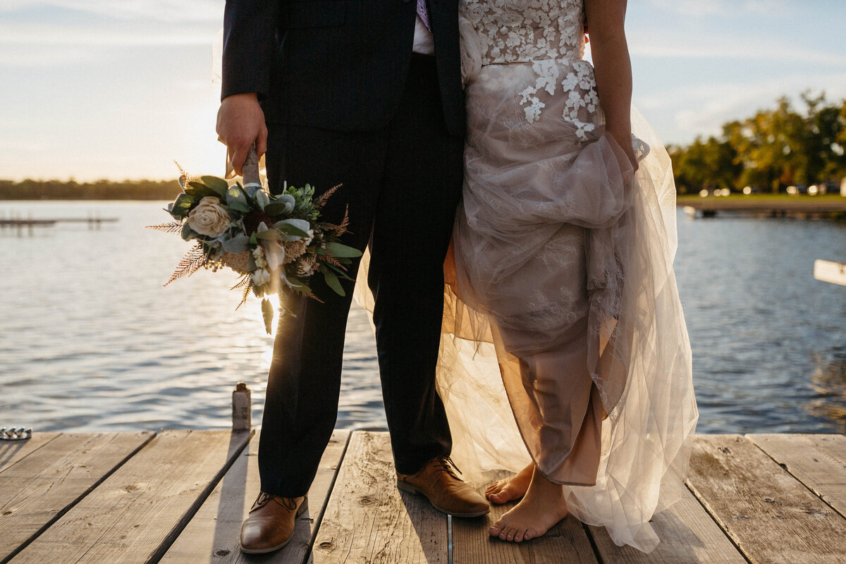 bride-and-groom-feet-standing-on-dock