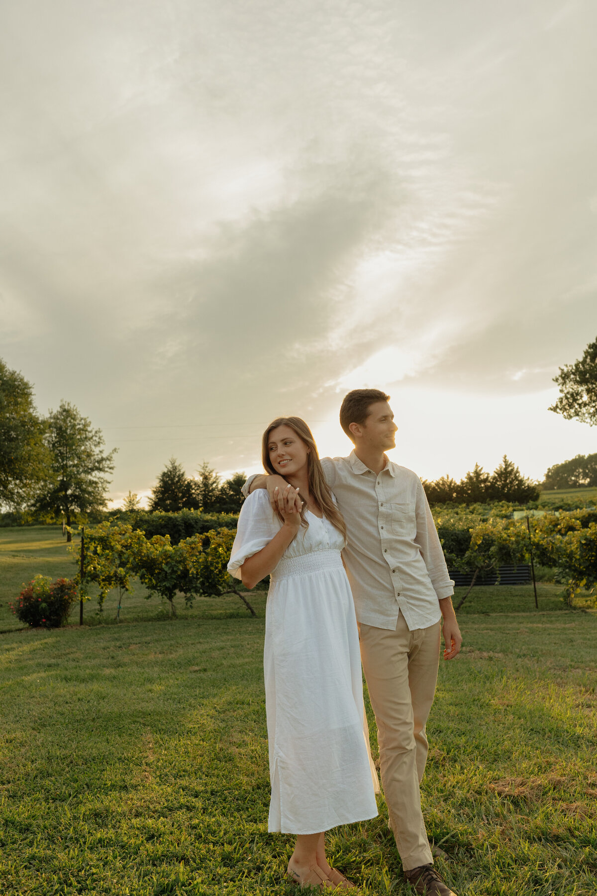 Intimate winery picnic session with lush palm trees and bright natural light

