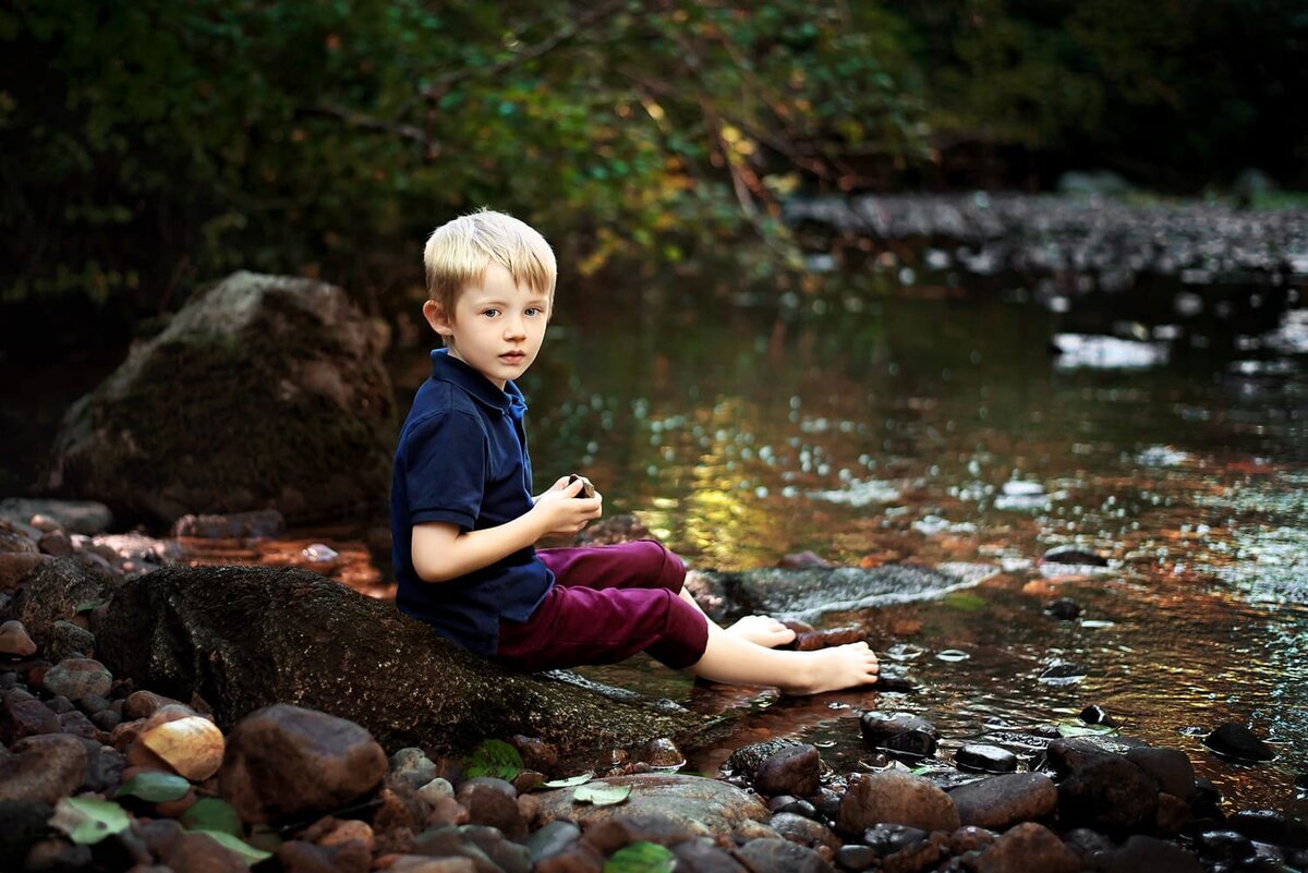 Child photoshoot of 4 year old boy sitting on a rock in a Burnaby area ravine
