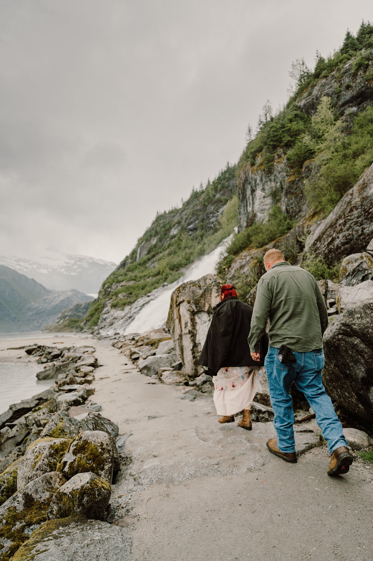 couple walk to the waterfall