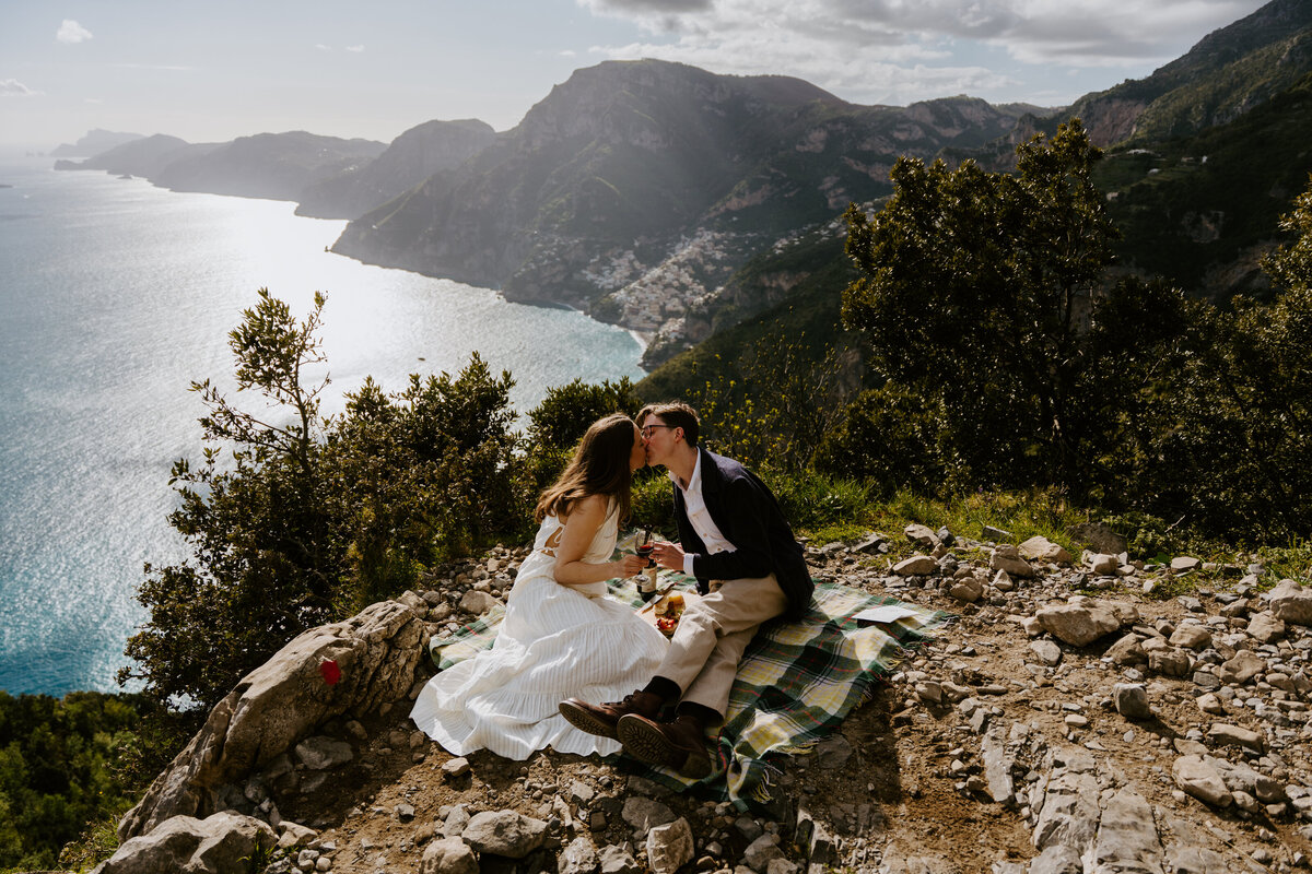 Couple having a picnic above the Amalfi Coast.
