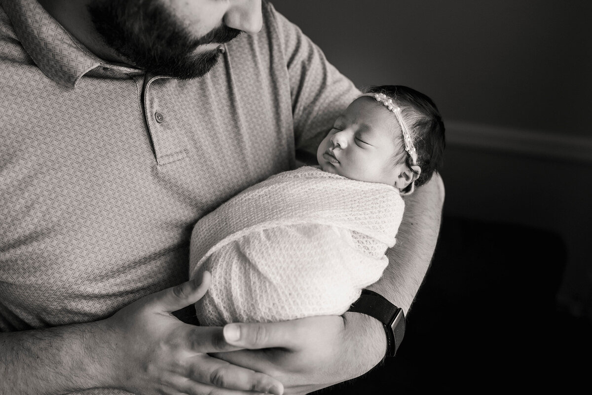 NJ Maternity photographer captures dad looking lovingly at his daughter