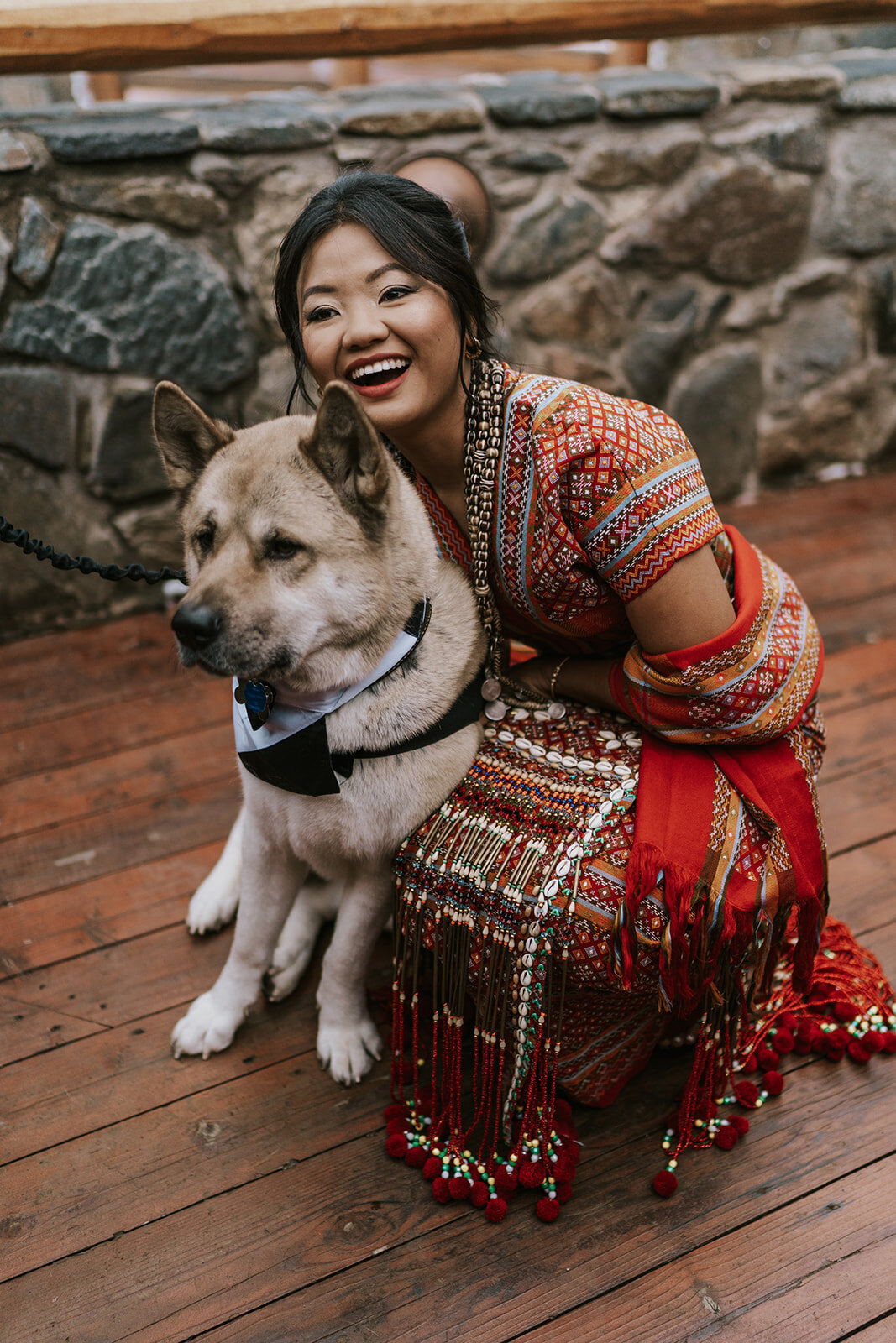 Southeast Asian bride with her dog on her wedding day.