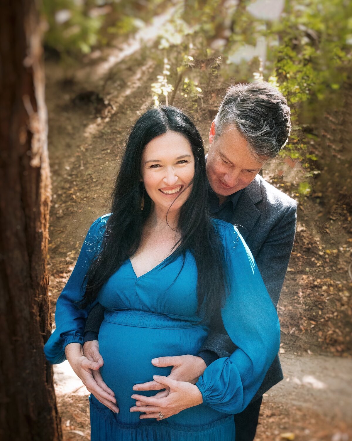 Husband embraces pregnant wife
