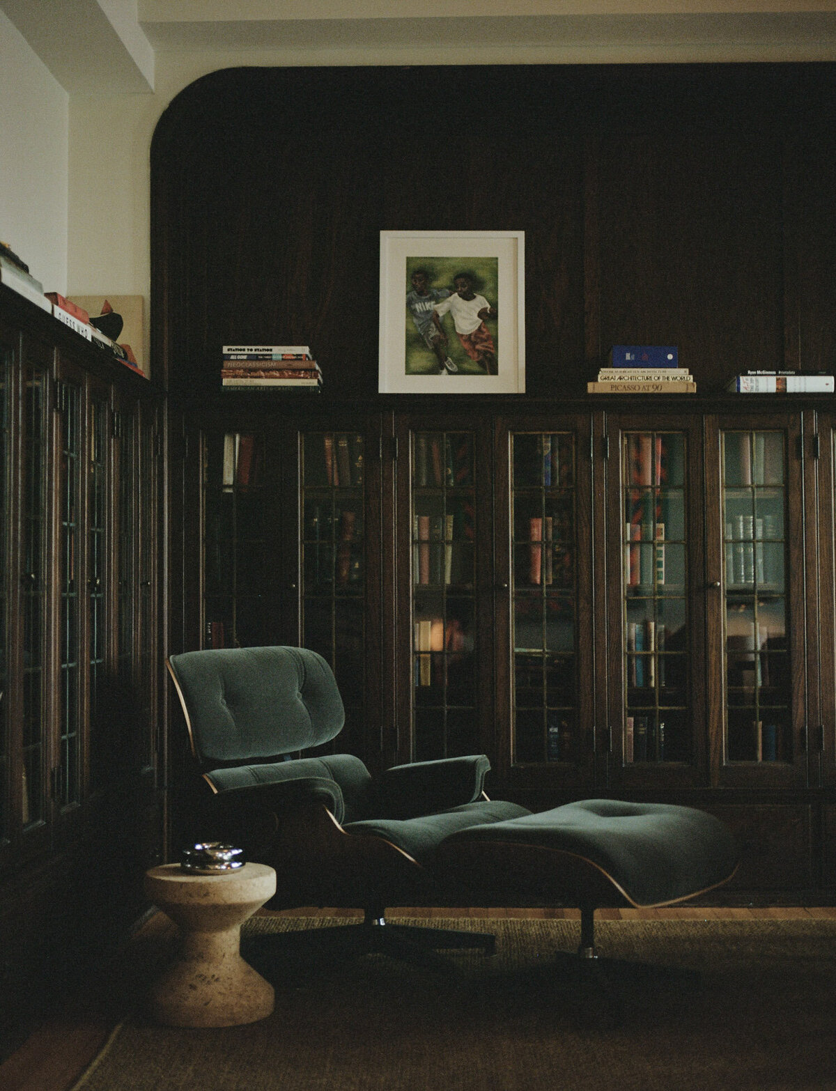 green upholstered reclining chair with corner bookshelves, mahogany, ALEO Detroit Little Village branding