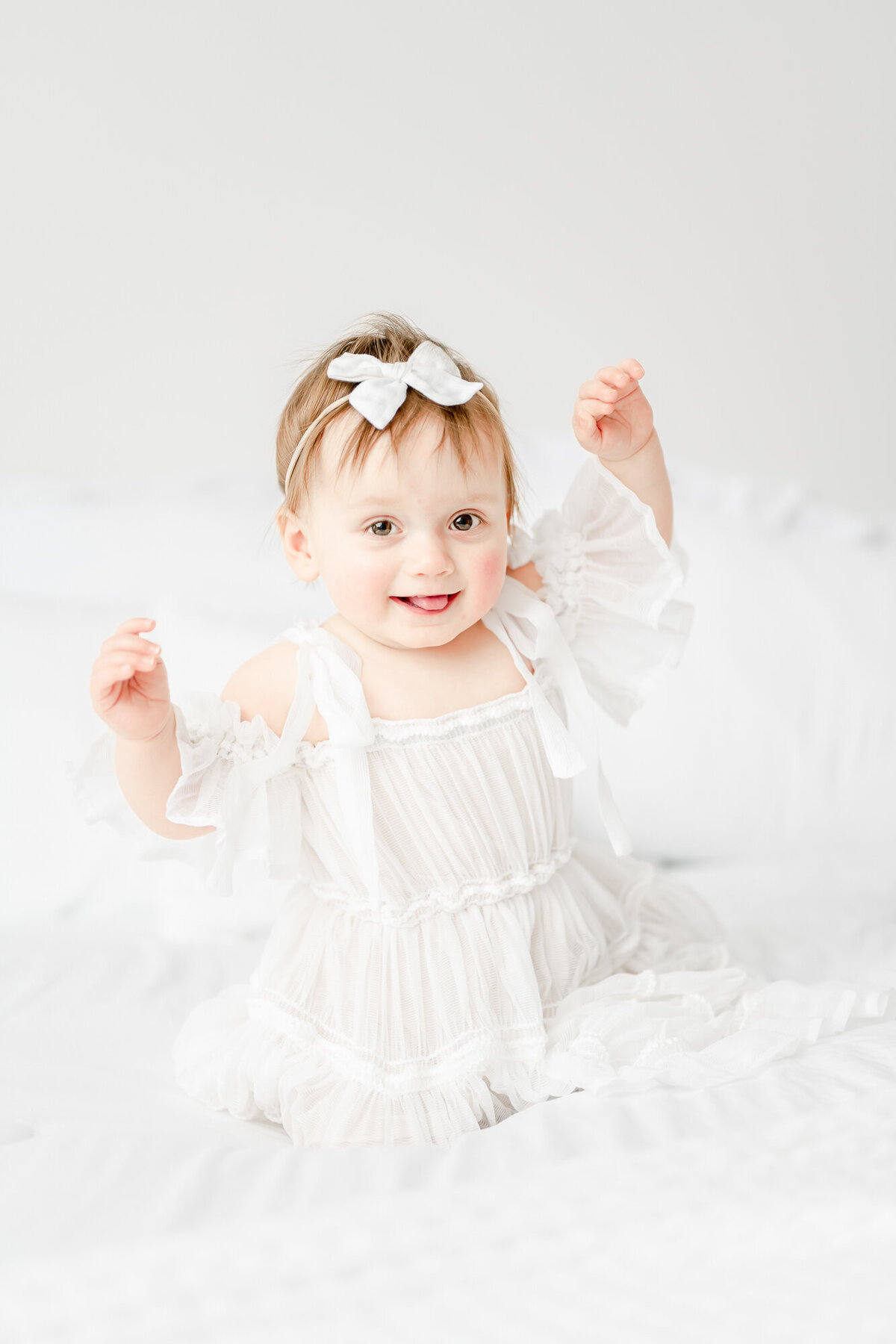 Postrait of a happy girl who celebrates her 1st birthday with a smash the cake photos session in New Jersey