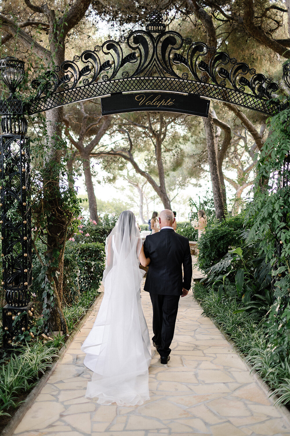 bride and father walking to ceremony at grand hotel du cap ferrat