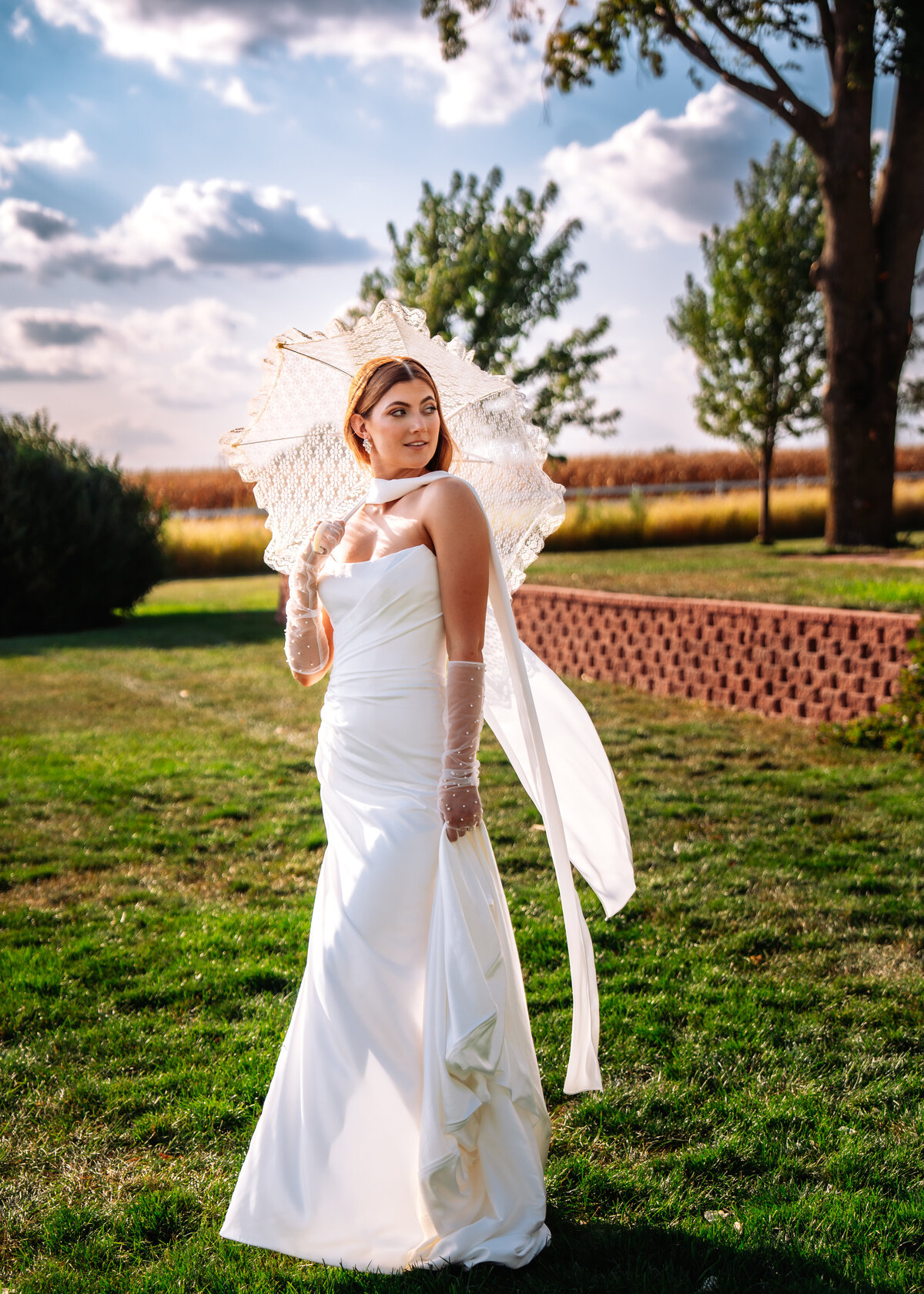 fine art wedding photography bridal portrait of bride holding a parasol at 1886 Farmhouse Boone Iowa Des Moines Iowa Wedding photographer 