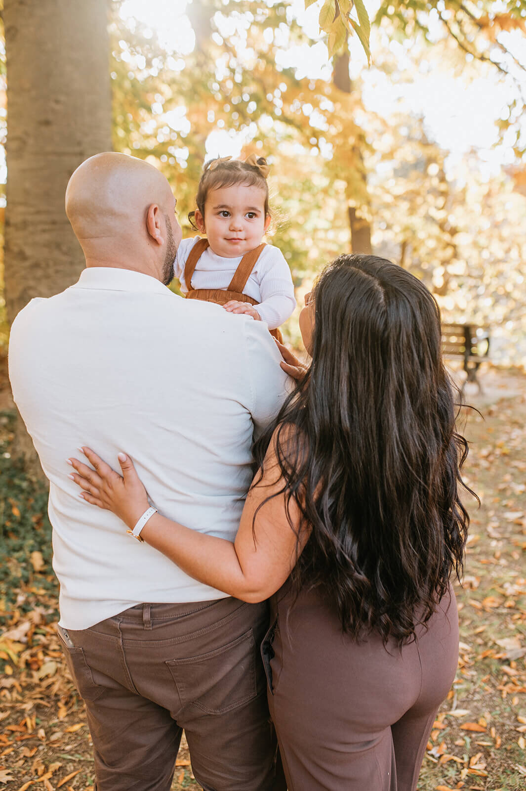 Parents-holding-child