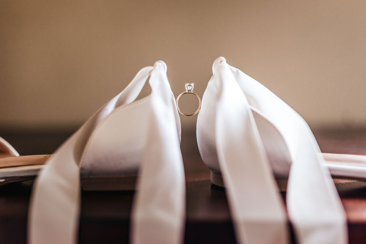 bridal shoes with ribbon ties and diamond engagement ring at Cobb Hill Estate wedding by Lisa Smith Photography