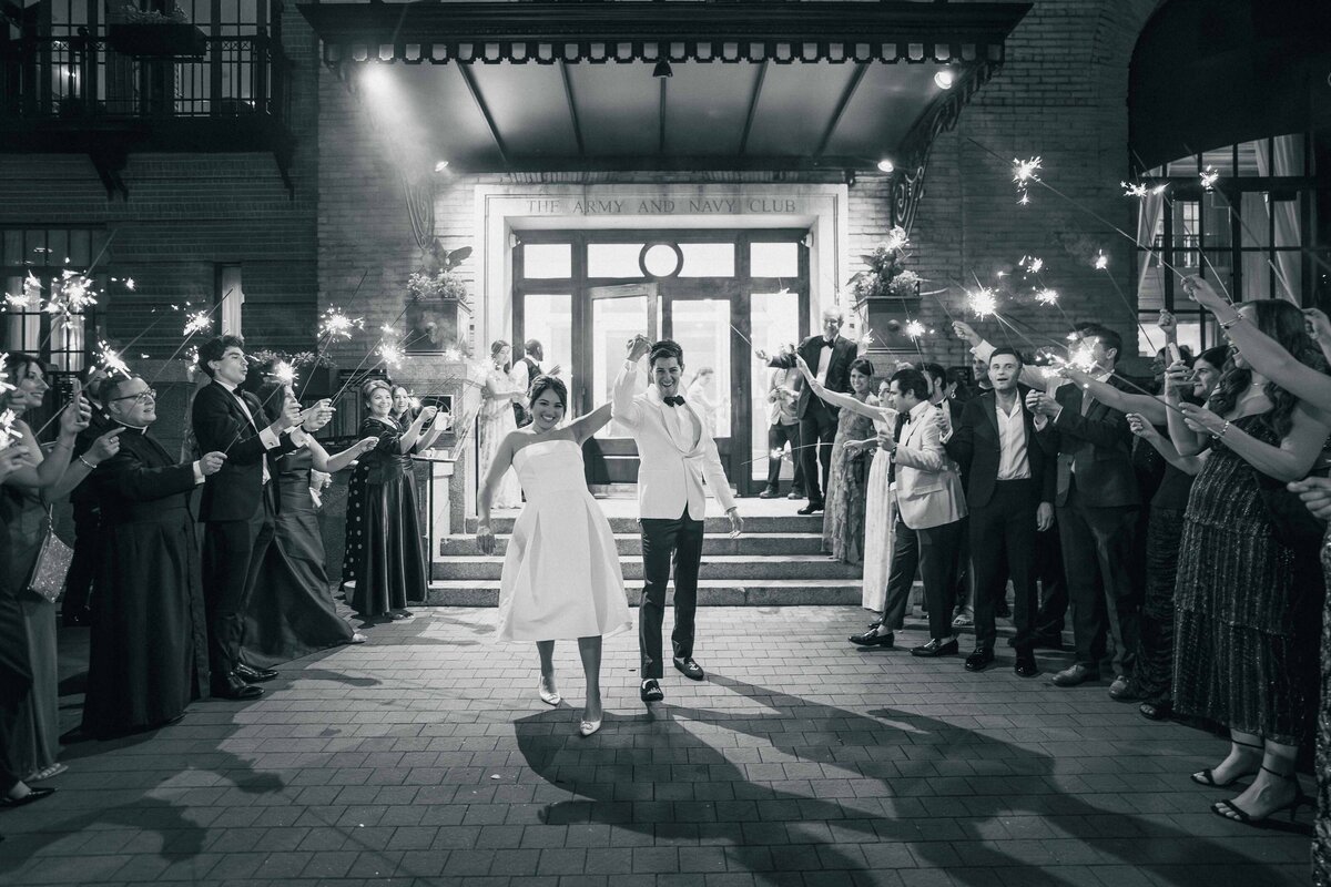 Bride and groom exit their wedding venue of the Army Navy Club in Washington D.C. Black White