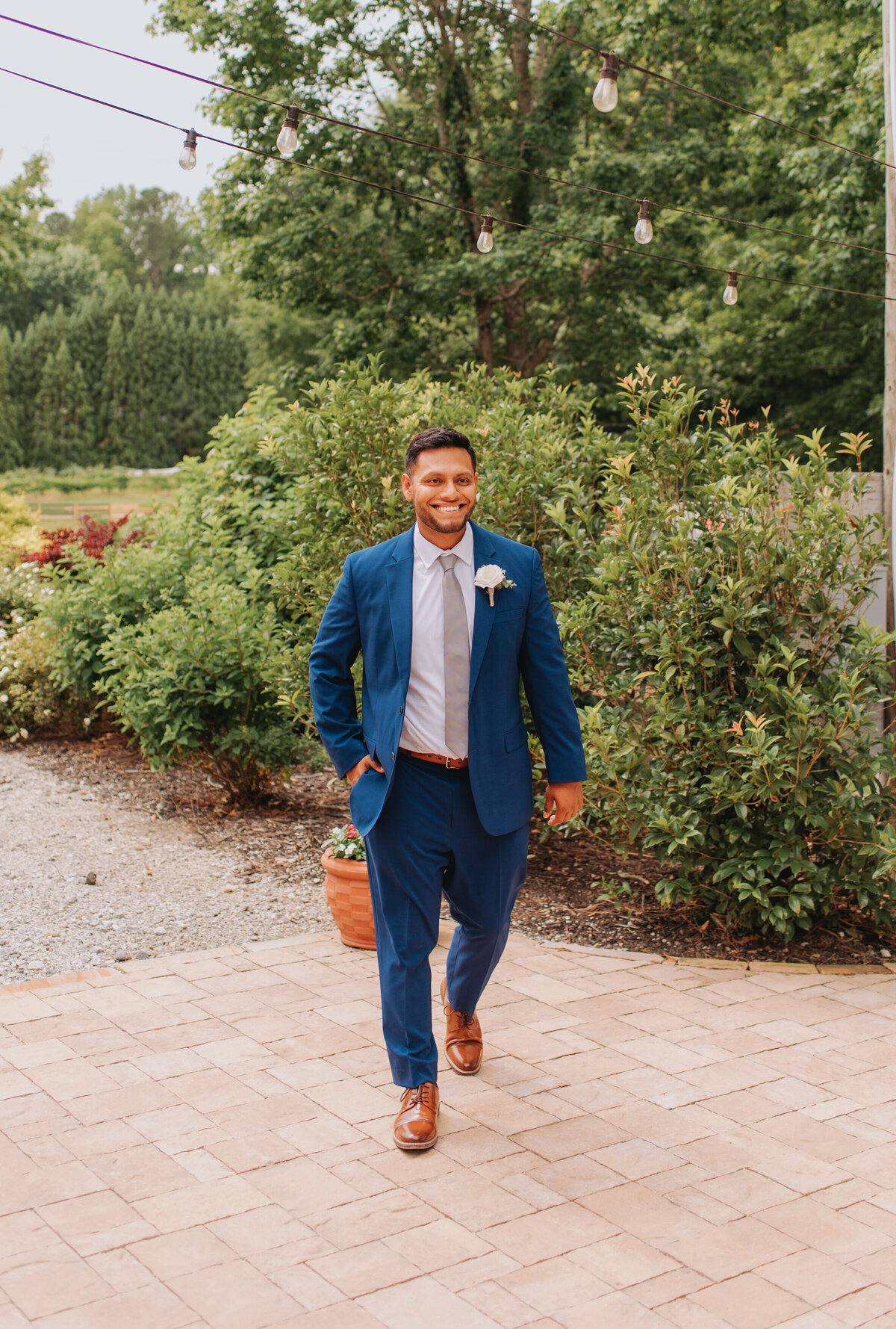 A merrier walks in a blue suit