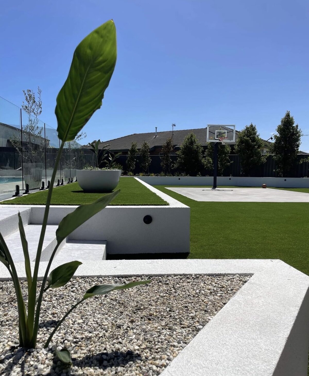 Sleek landscape design with retaining walls and basketball court Warrnambool