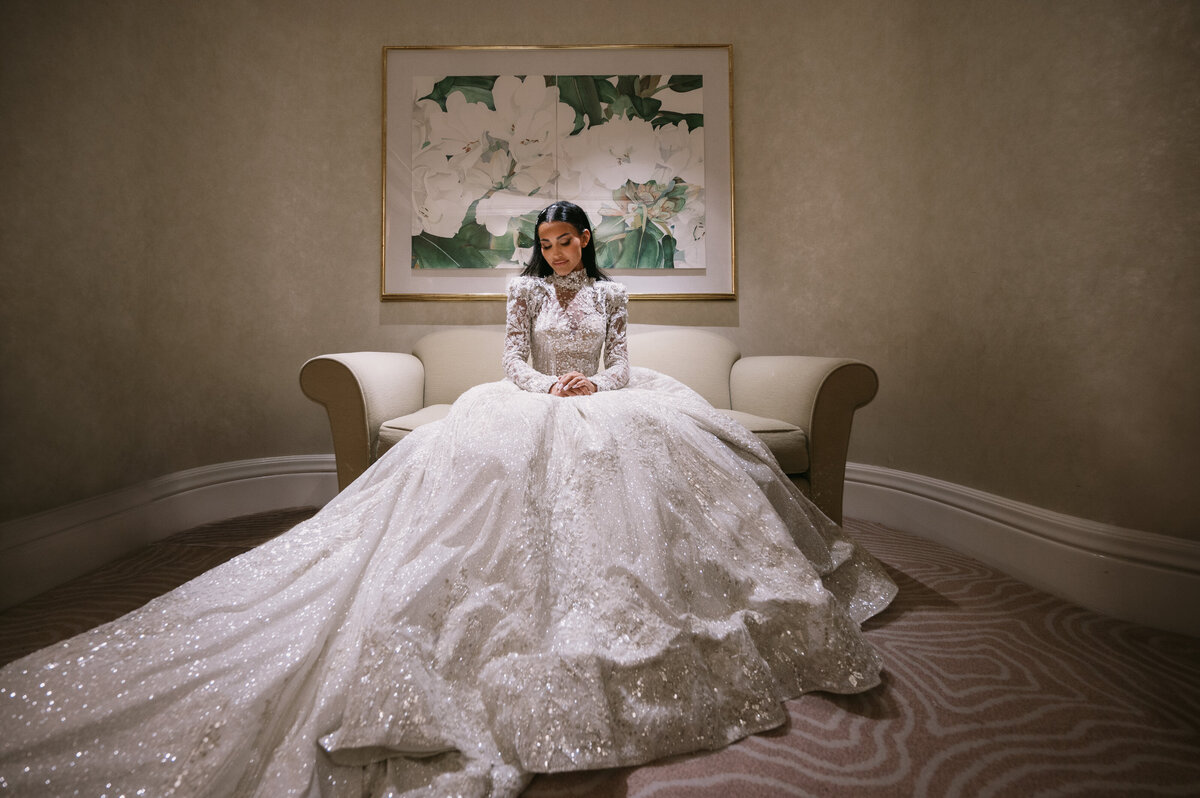 gorgeous bride Ashley - a peaceful moment before the ceremony. She is sitting on a couch and relaxing.