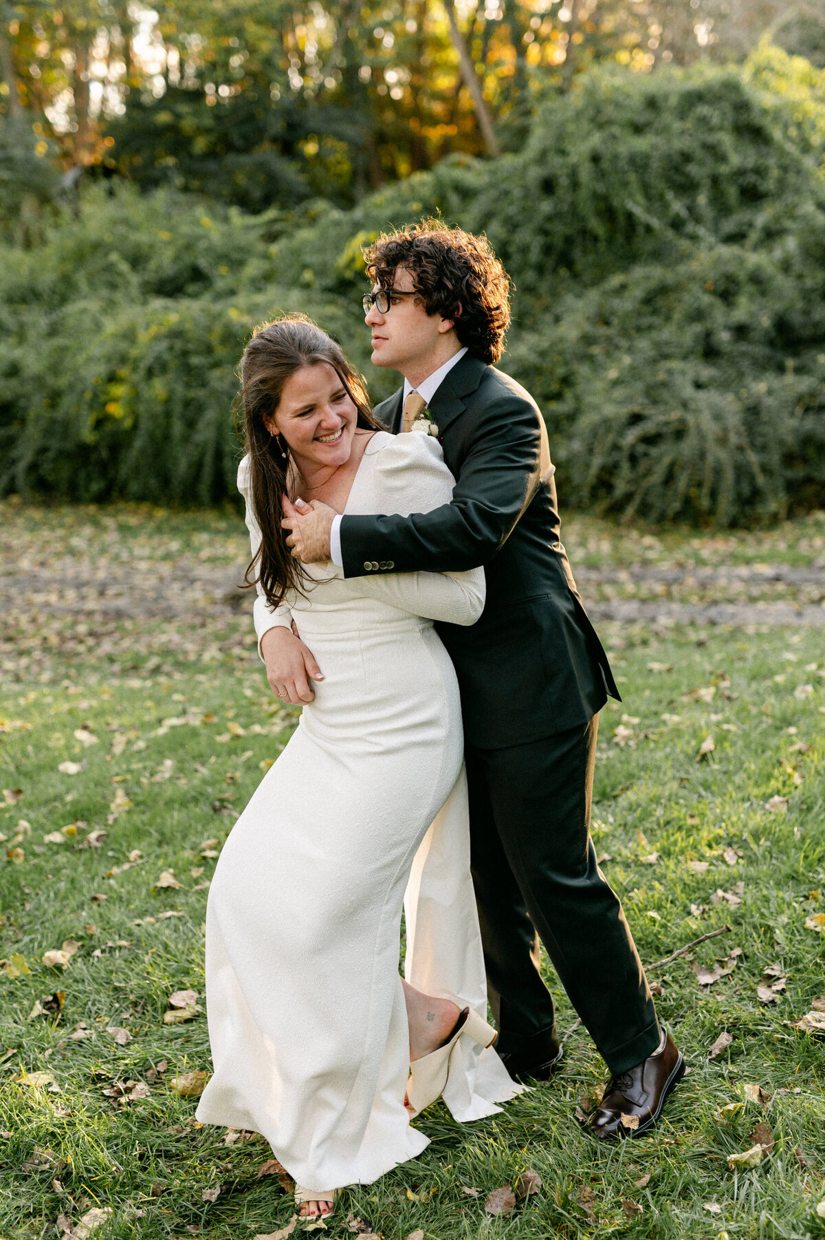 Bride and groom hugging and laughing