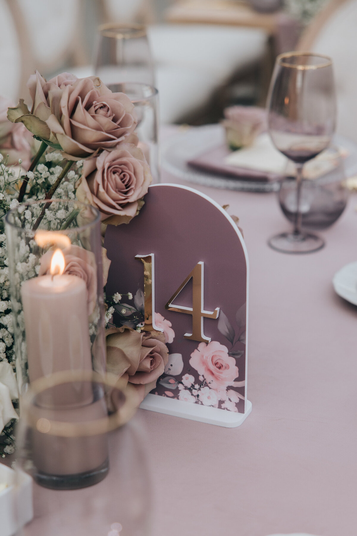 Lavender and floral themed table number at glamorous wedding