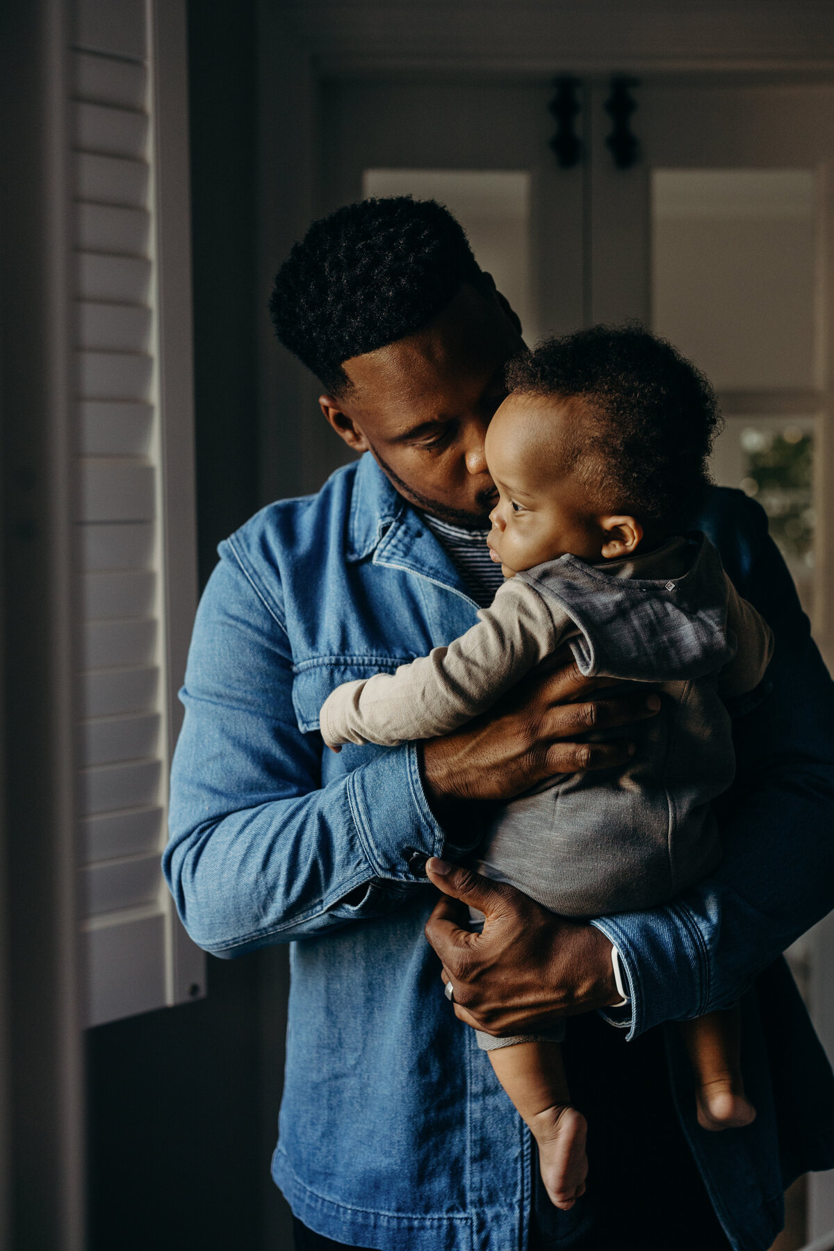 intimate photo of dad holding his baby