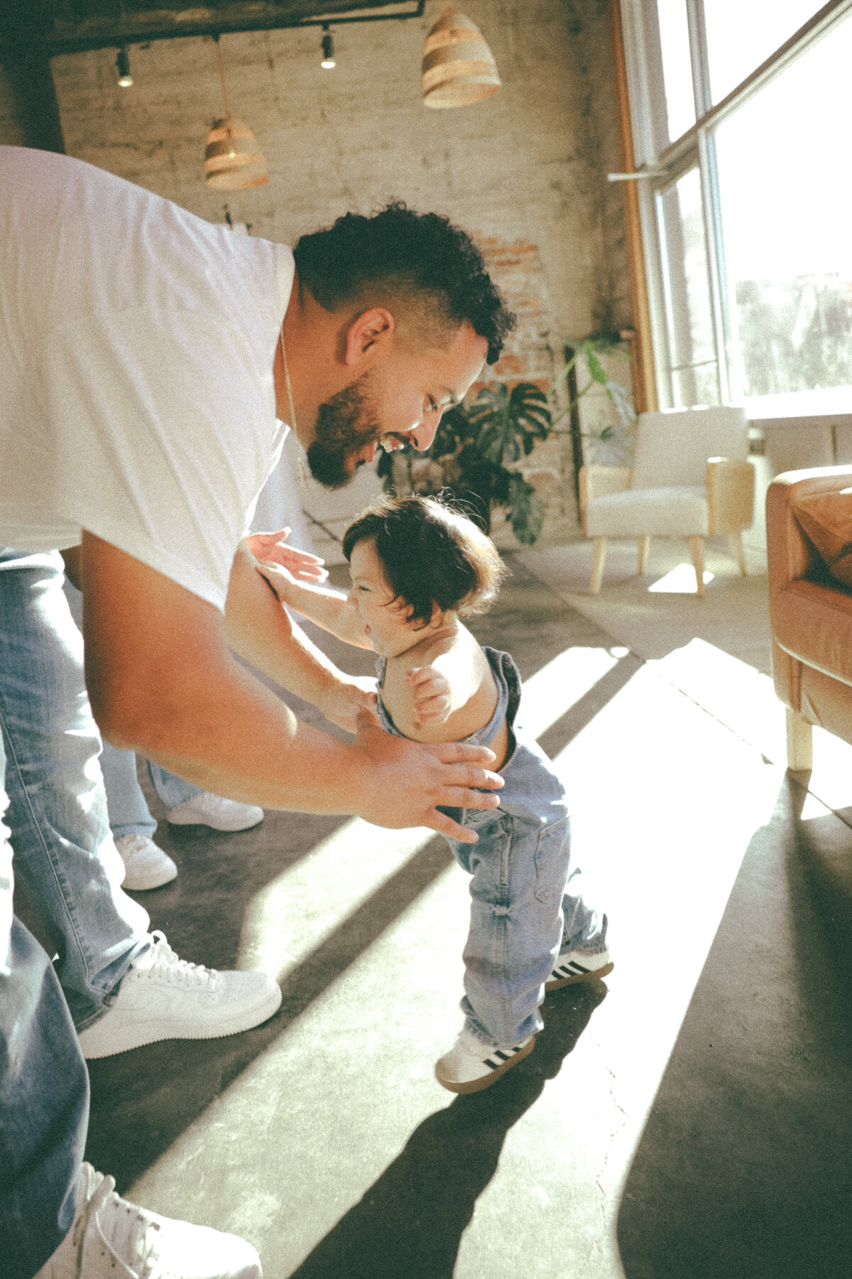 Father Playing with Toddler in Natural Light Studio Family Session