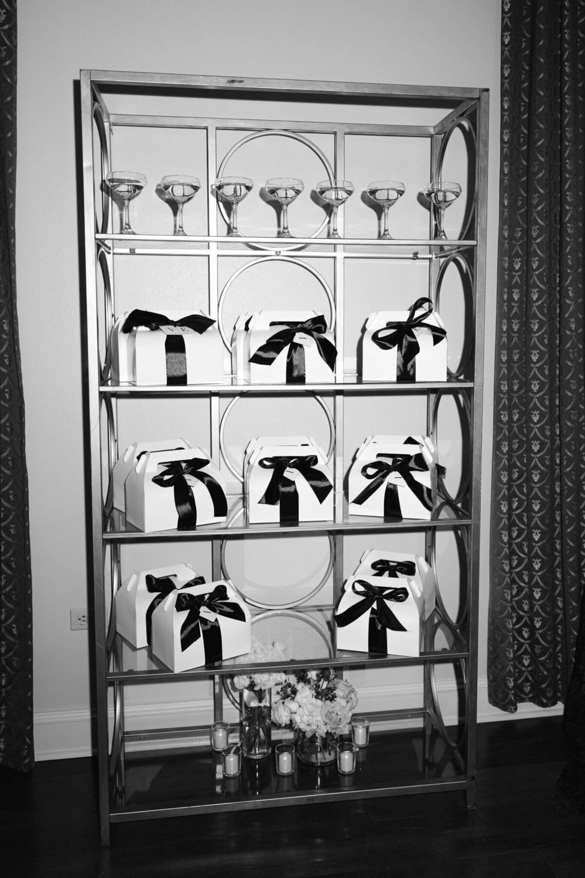 A black and white wedding picture of gift bags for the wedding guests
