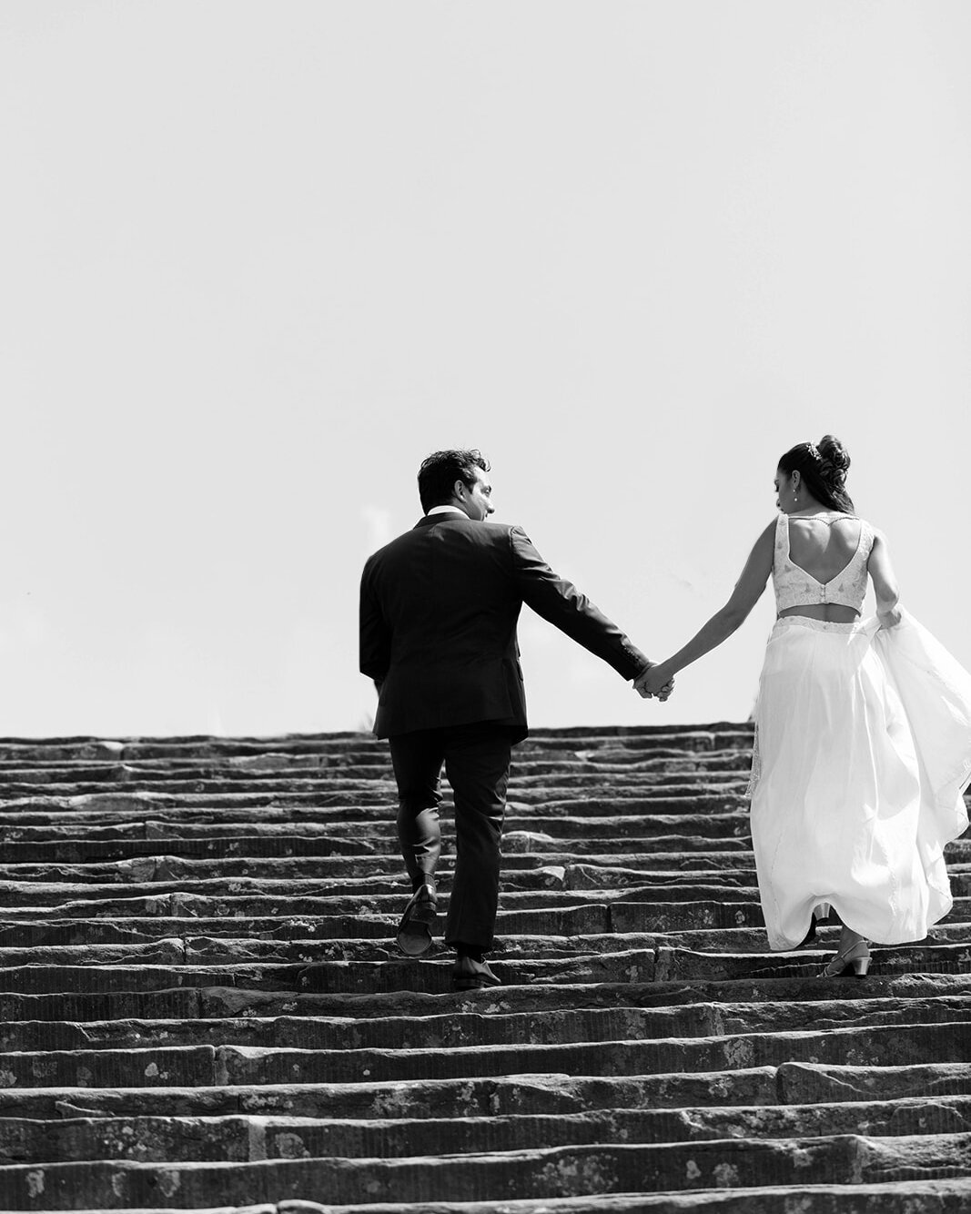 bride and groom holding hands piazzale michelangelo florence italy wedding